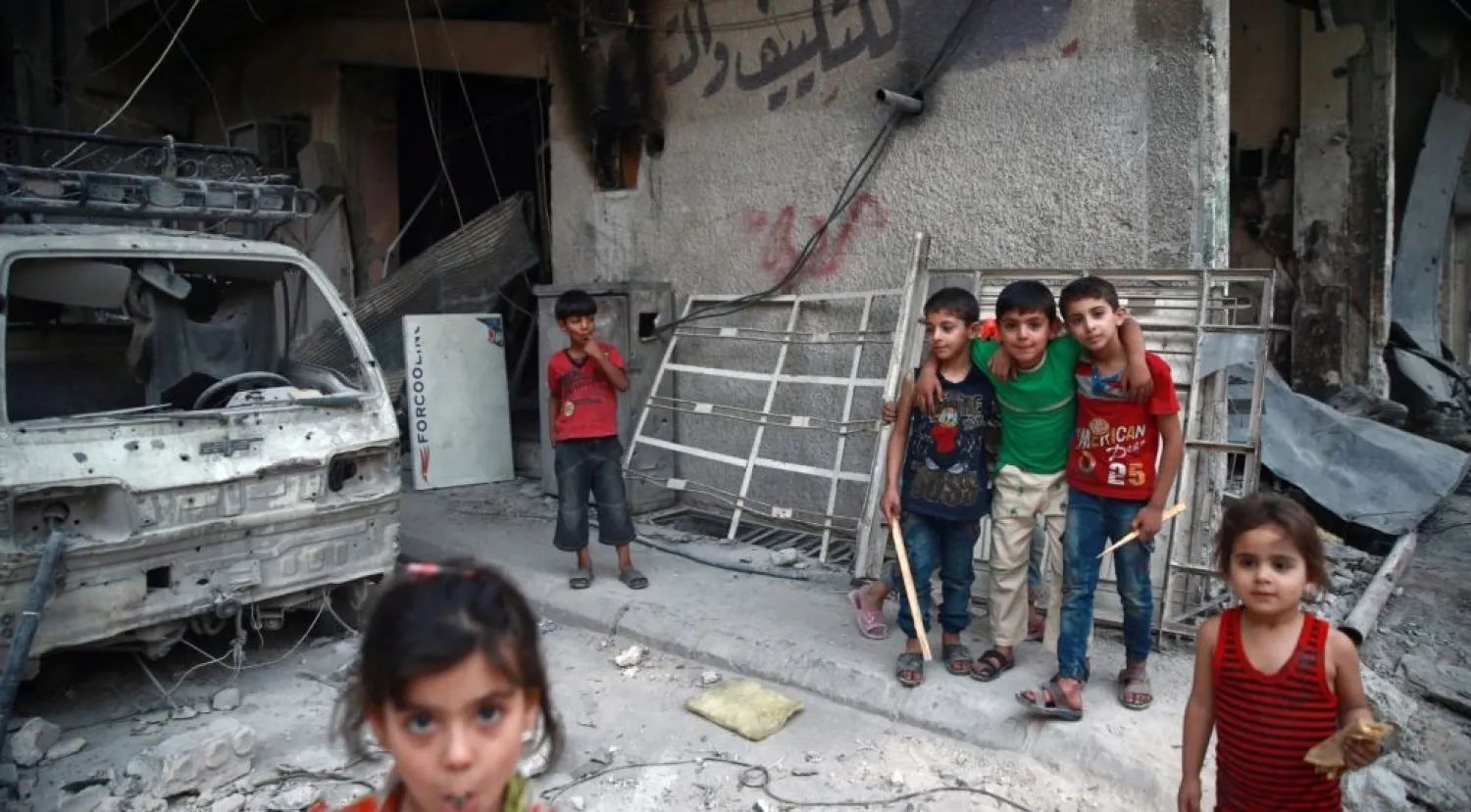Children are seen near rubble of damaged buildings in the eastern Damascus suburb of Ghouta, Syria, July 17, 2017, Reuters 