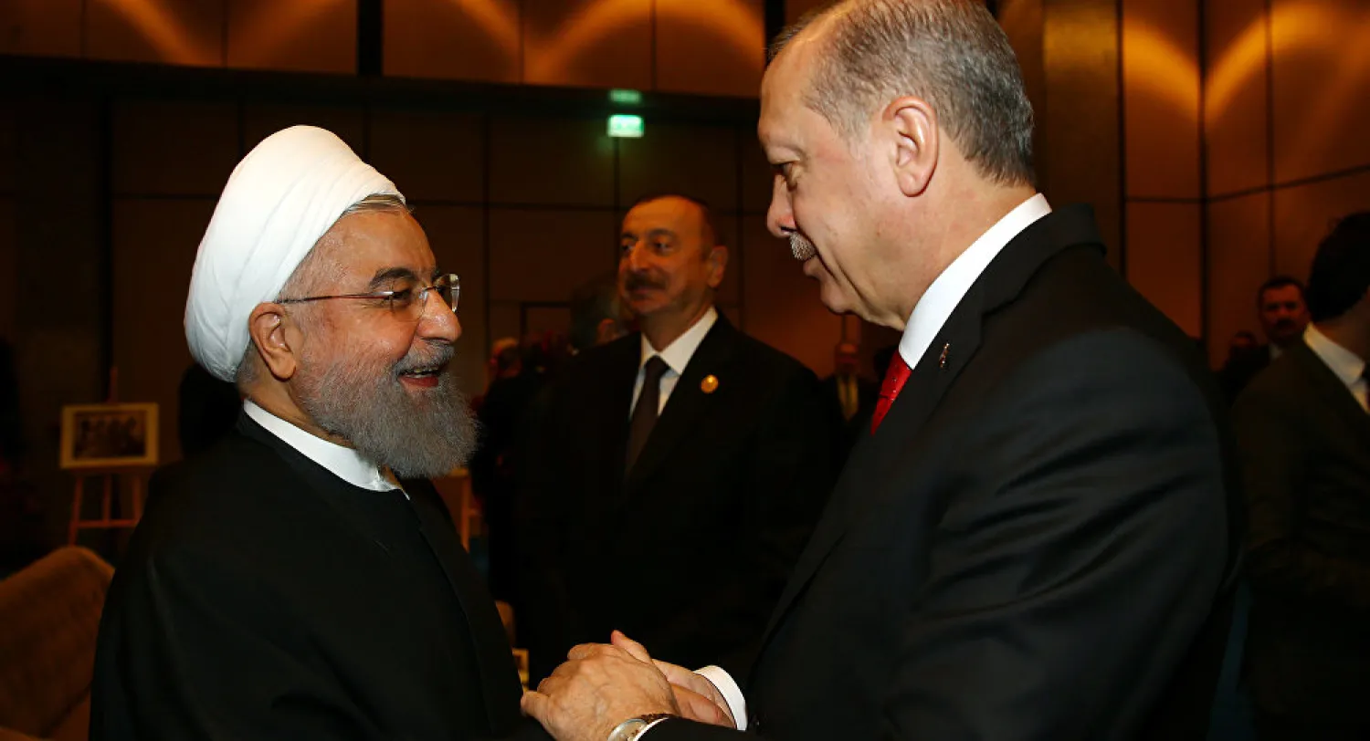 Turkish President Recep Tayyip Erdogan shakes hands with Iran's President Hassan Rouhani. Reuters file photo