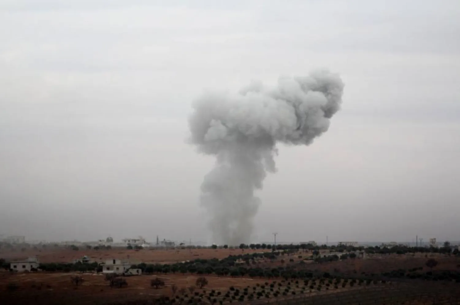 A cloud of smoke is seen near Al-Tamanah in Syria's province of Idlib. AFP file photo