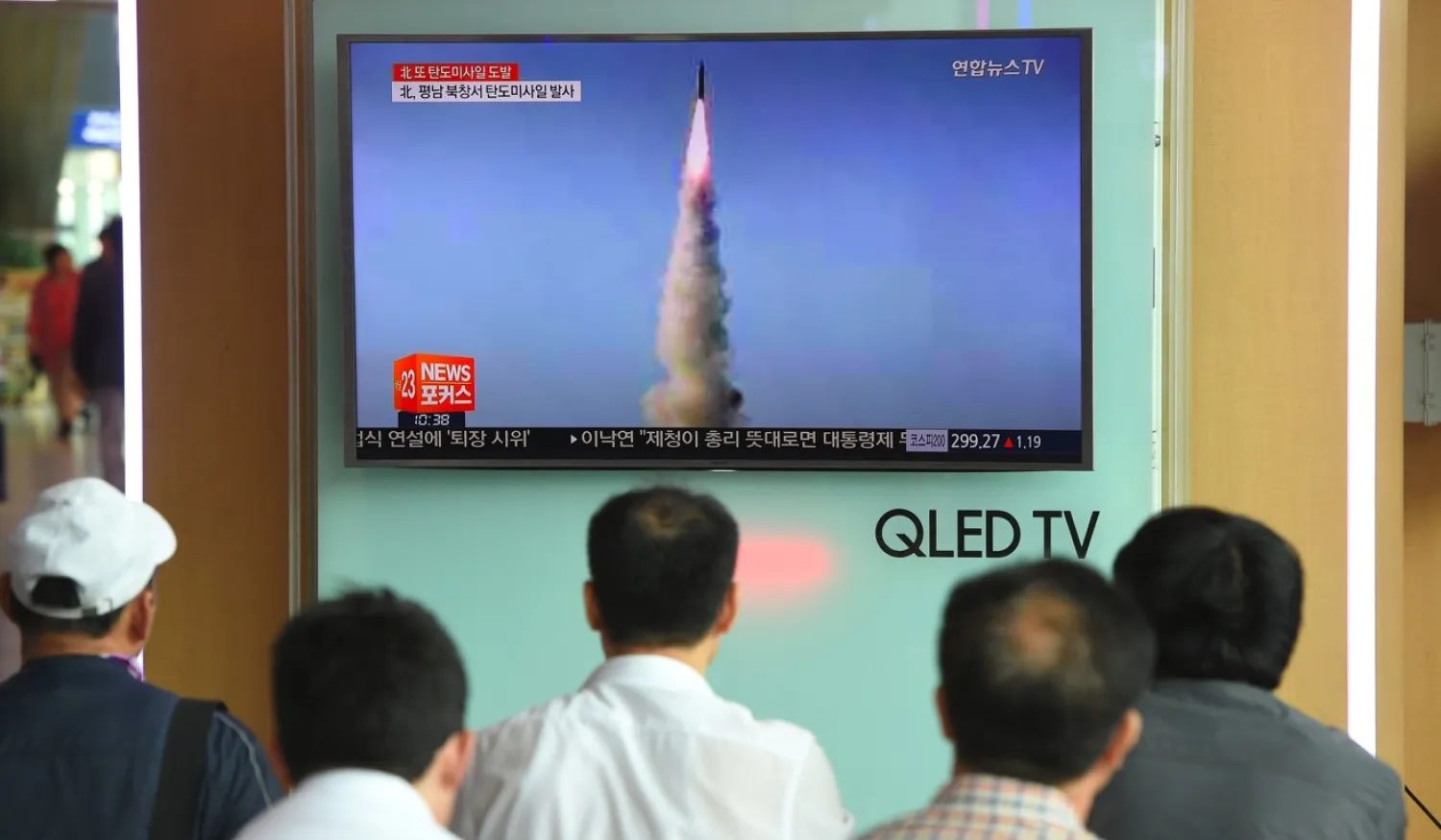 South Koreans watch a news report on the North’s missile test of a Pukguksong-2, at a railway station in Seoul. AFP file photo