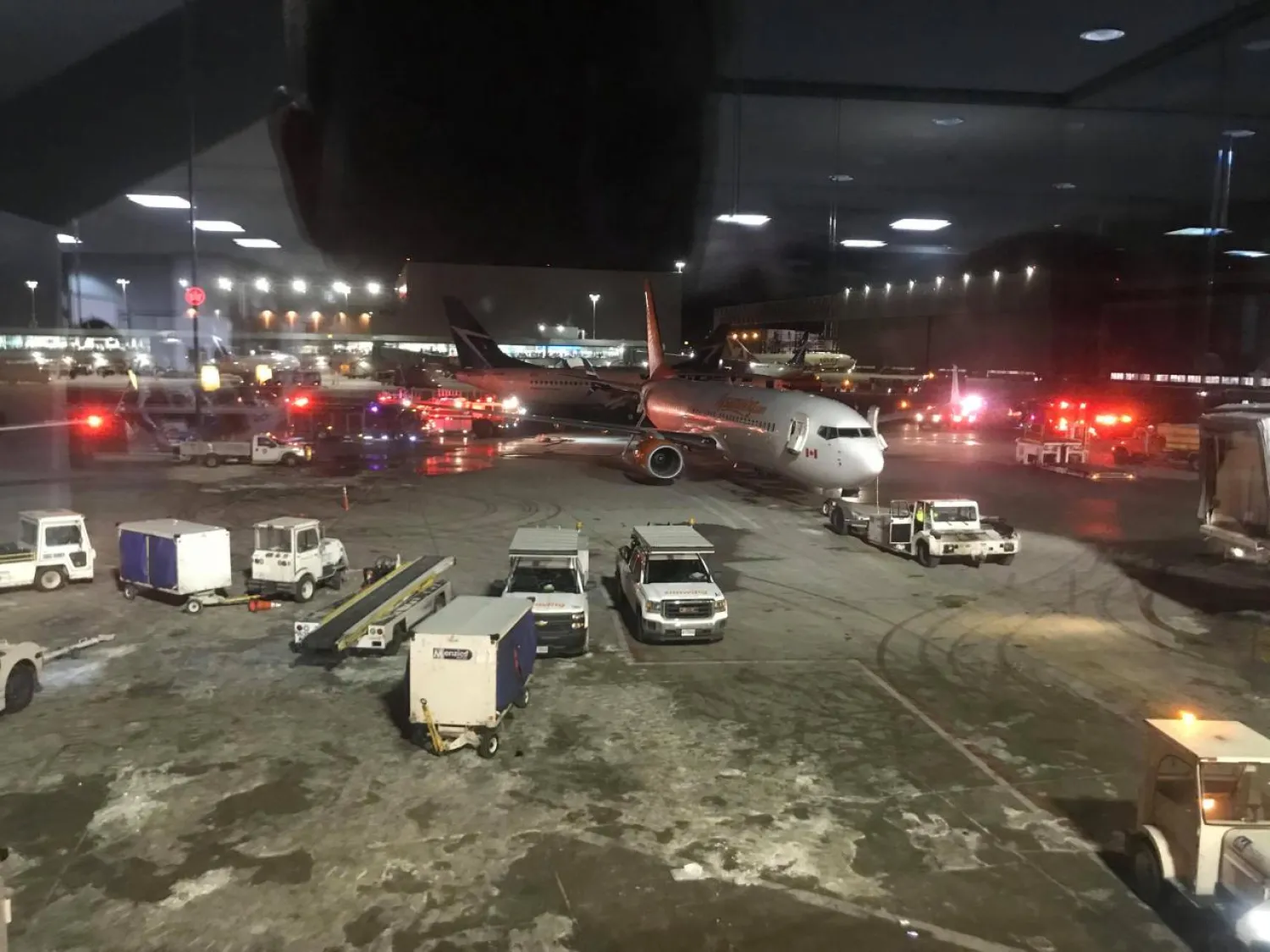Emergency services arrive at a site where two planes collided at Toronto's Pearson Airport, Canada, January 5, 2018 in this still image taken from social media video. John-Ross Parks/via REUTERS