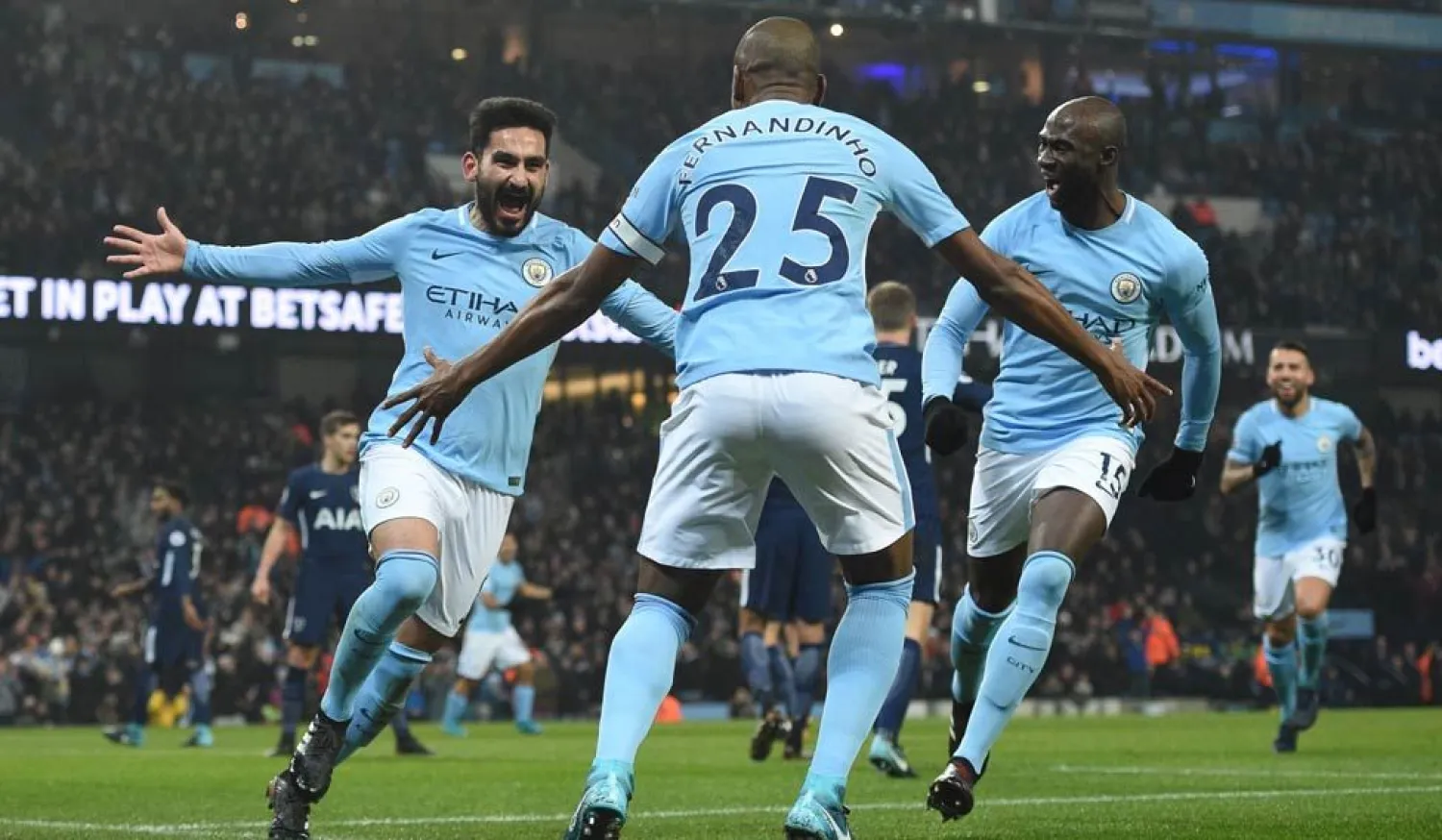 Manchester City's Ilkay Gundogan (left) celebrates after scoring a goal during their match against Tottenham Hotspur at the Etihad Stadium in December 2017. (AFP)