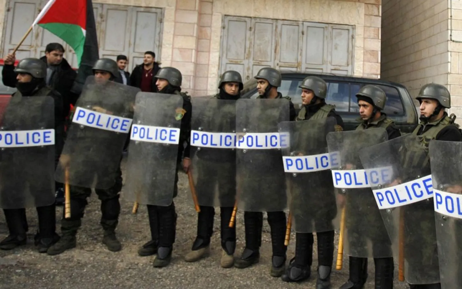 Palestinian policemen stand guard as the convoy of Jerusalem's Greek Orthodox Patriarch Theophilos III arrives in the West Bank town of Bethlehem. (Getty Images)