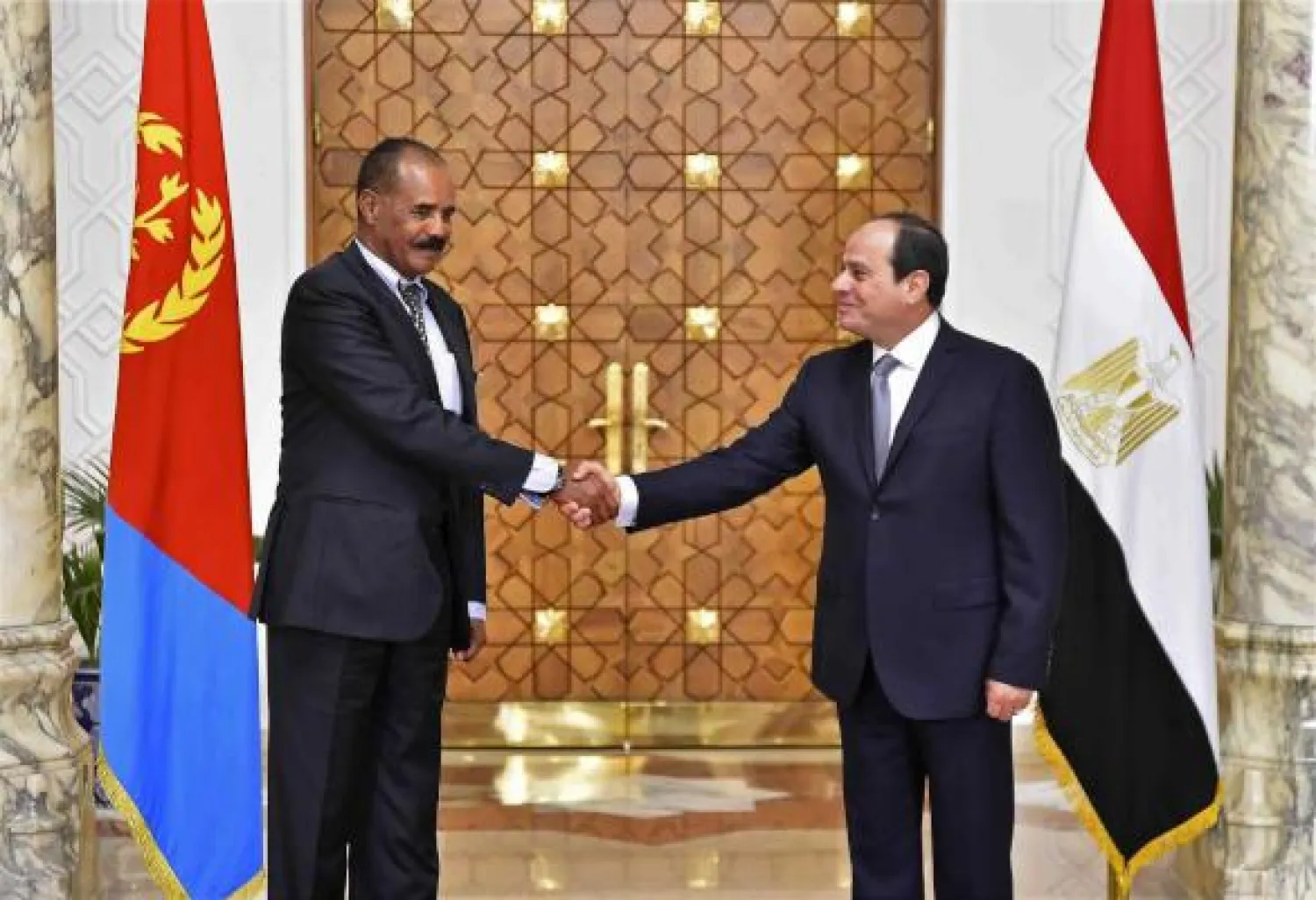  In this photo provided by Egypt’s state news agency, MENA, Eritrean President Isaias Afwerki, left, shakes hands with Egyptian President Abdel Fattah el-Sisi at the presidential palace, in Cairo, Egypt, Tuesday, Jan. 9, 2018. AP 
