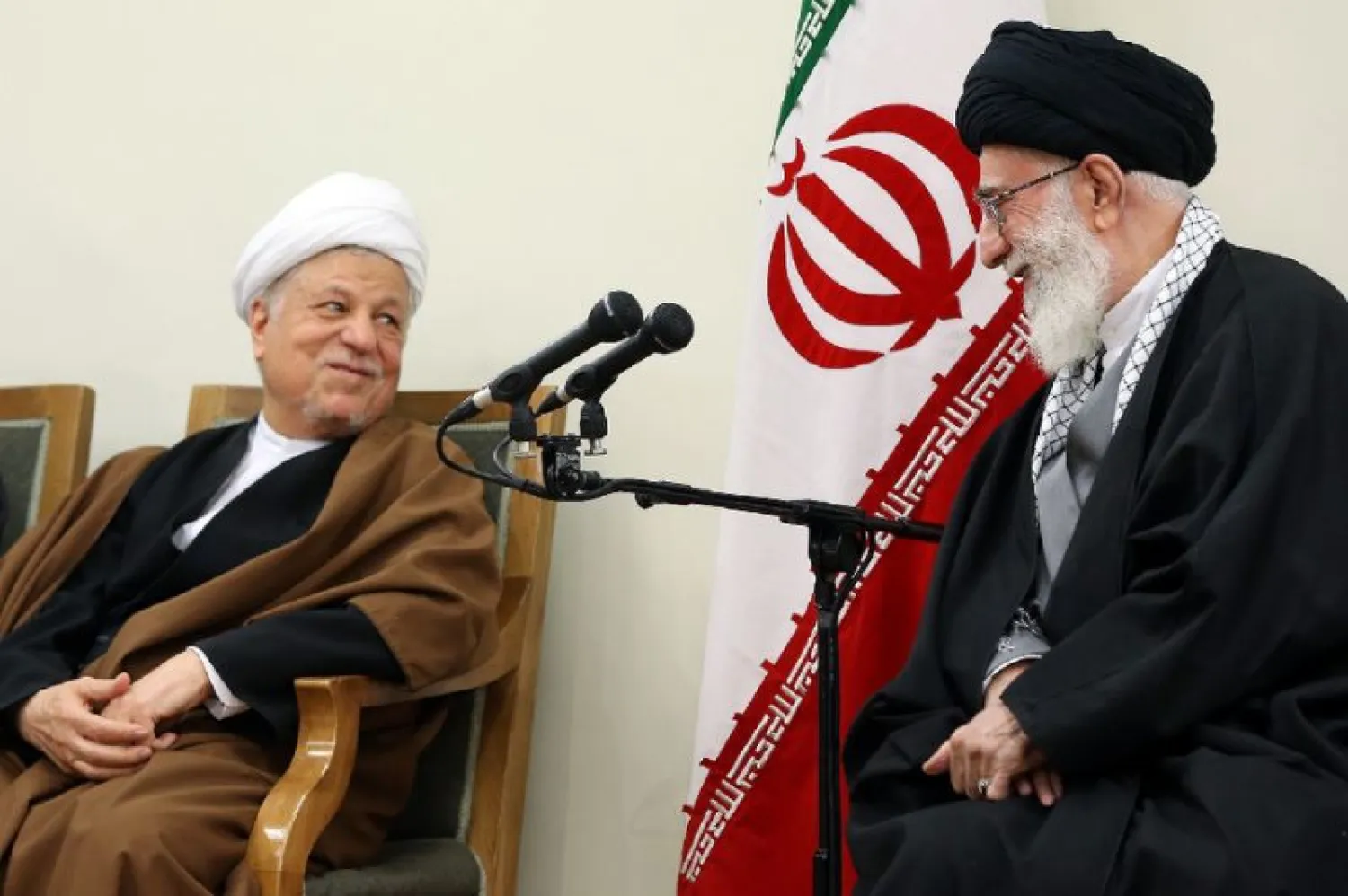 Iran's supreme leader Ali Khamenei (R) speaks with former president Akbar Hashemi Rafsanjani during a meeting in Tehran. (AFP)