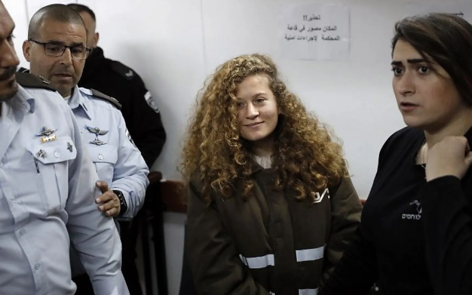 Sixteen-year-old Palestinian Ahed Tamimi (2-R) attends a hearing at the Ofer military court in the West Bank on January 15, 2018. (AFP)