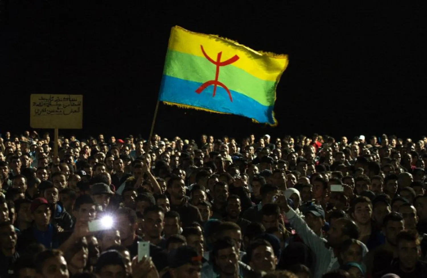 This file photo taken on October 30, 2016 shows protesters waving the Berber flag as they demonstrate in Morocco's northern city of Al-Hoceima (AFP Photo/FADEL SENNA)
