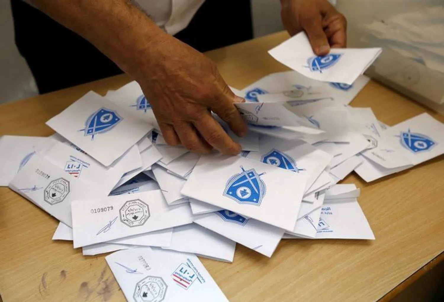 A Lebanese election official counts ballots after the polling station closed during Beirut’s municipal elections in Lebanon, May 8, 2016. REUTERS/Mohamed Azakir