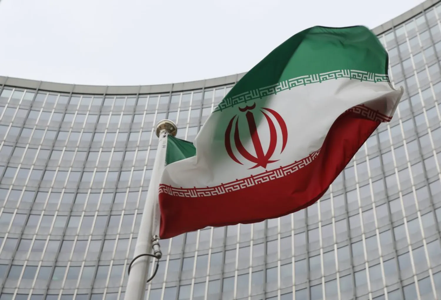 An Iranian flag flutters in front of the International Atomic Energy Agency (IAEA) headquarters in Vienna, Austria. (Reuters)