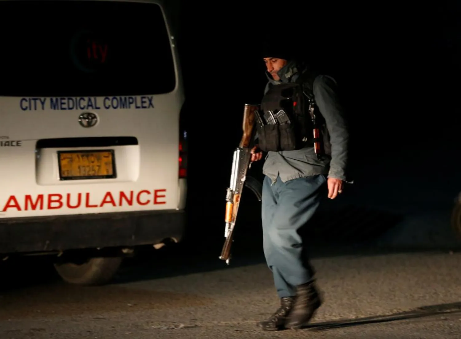 An Afghan policeman keeps watch near the site of an attack on the Intercontinental Hotel in Kabul, Afghanistan January 20, 2018. REUTERS/Omar Sobhani