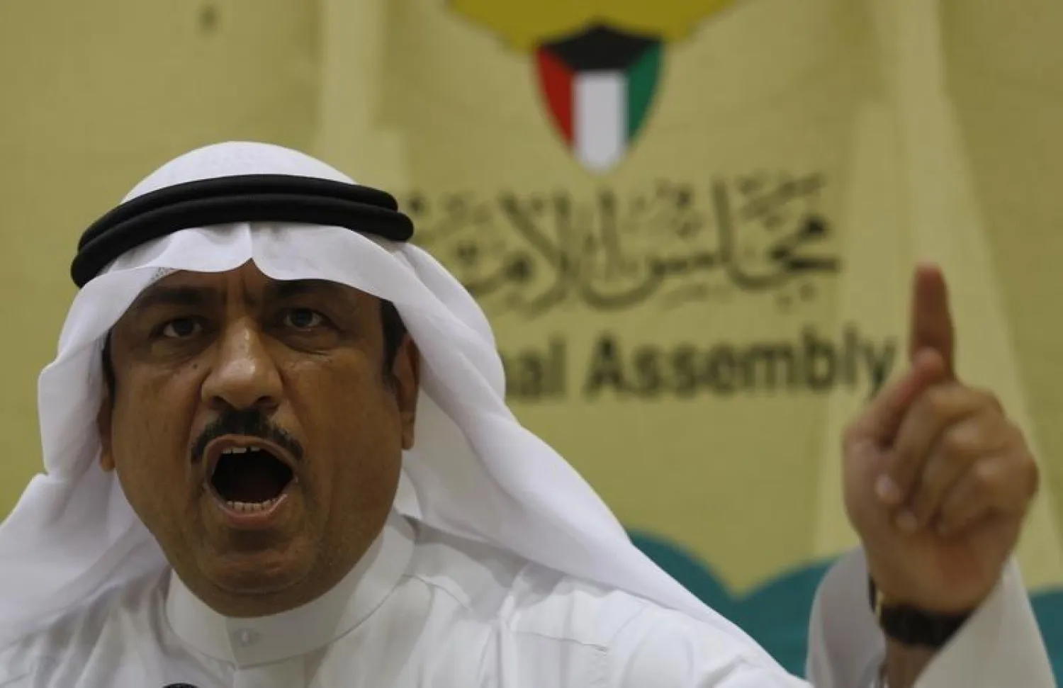 Kuwaiti lawmaker Musallam al-Barrak gestures while speaking to journalists at Parliament's media center in Kuwait City November 20, 2011. REUTERS/Hamad I Mohammed