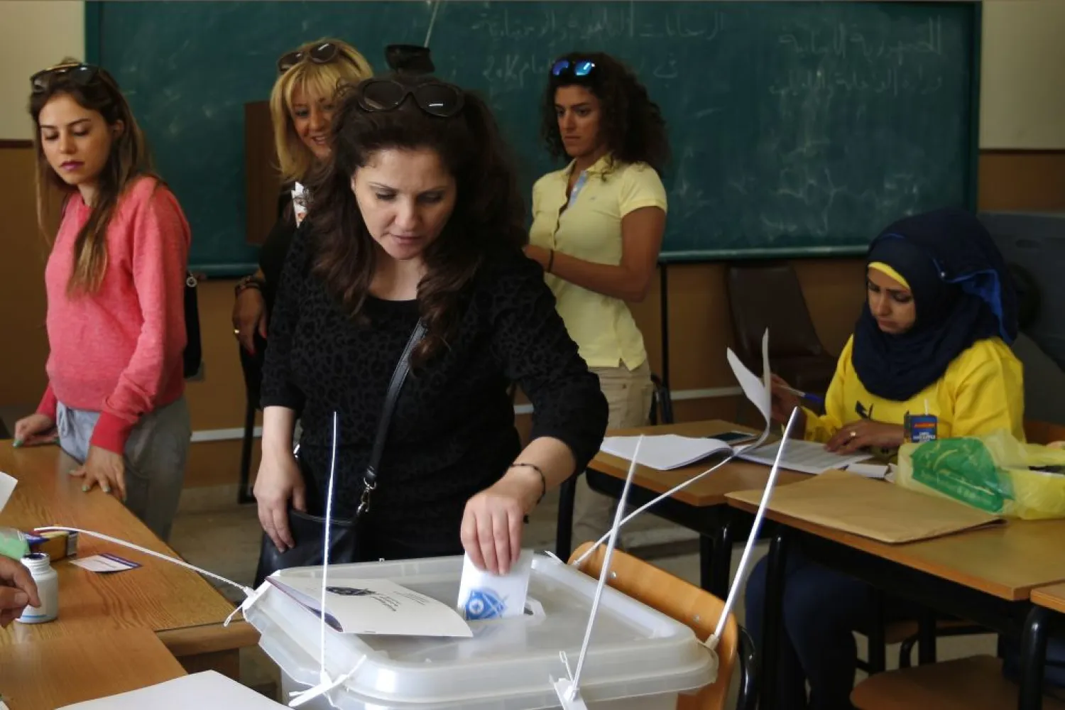 A Lebanese woman casts her vote at a polling station during the municipal elections in Beirut, Lebanon, May 8, 2016. (AP/Hassan Ammar)
 