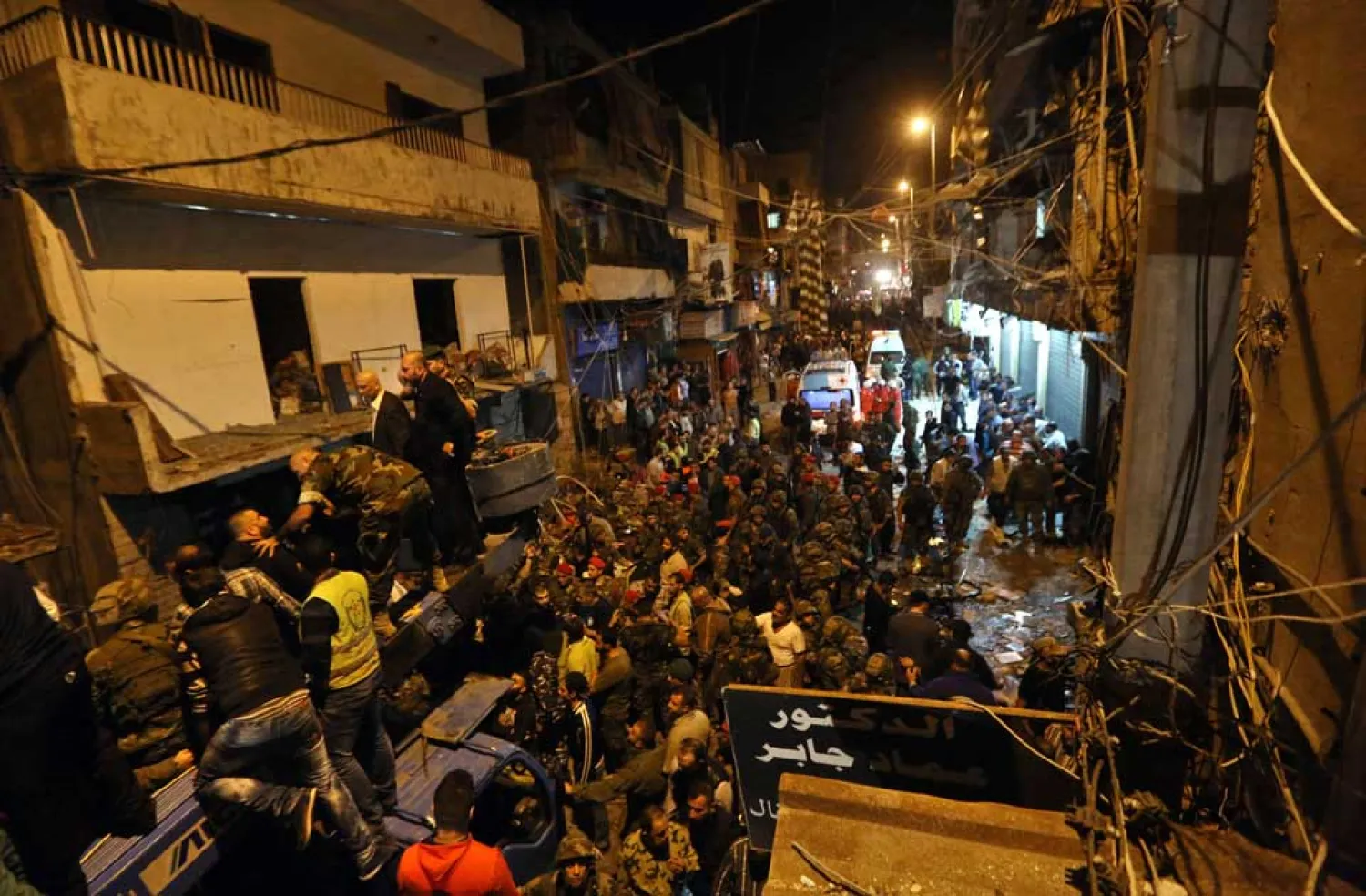 Lebanese army and civilians gather near the site of a twin suicide attack in Bourj al-Barajneh, southern Beirut in November 2015. (AP)