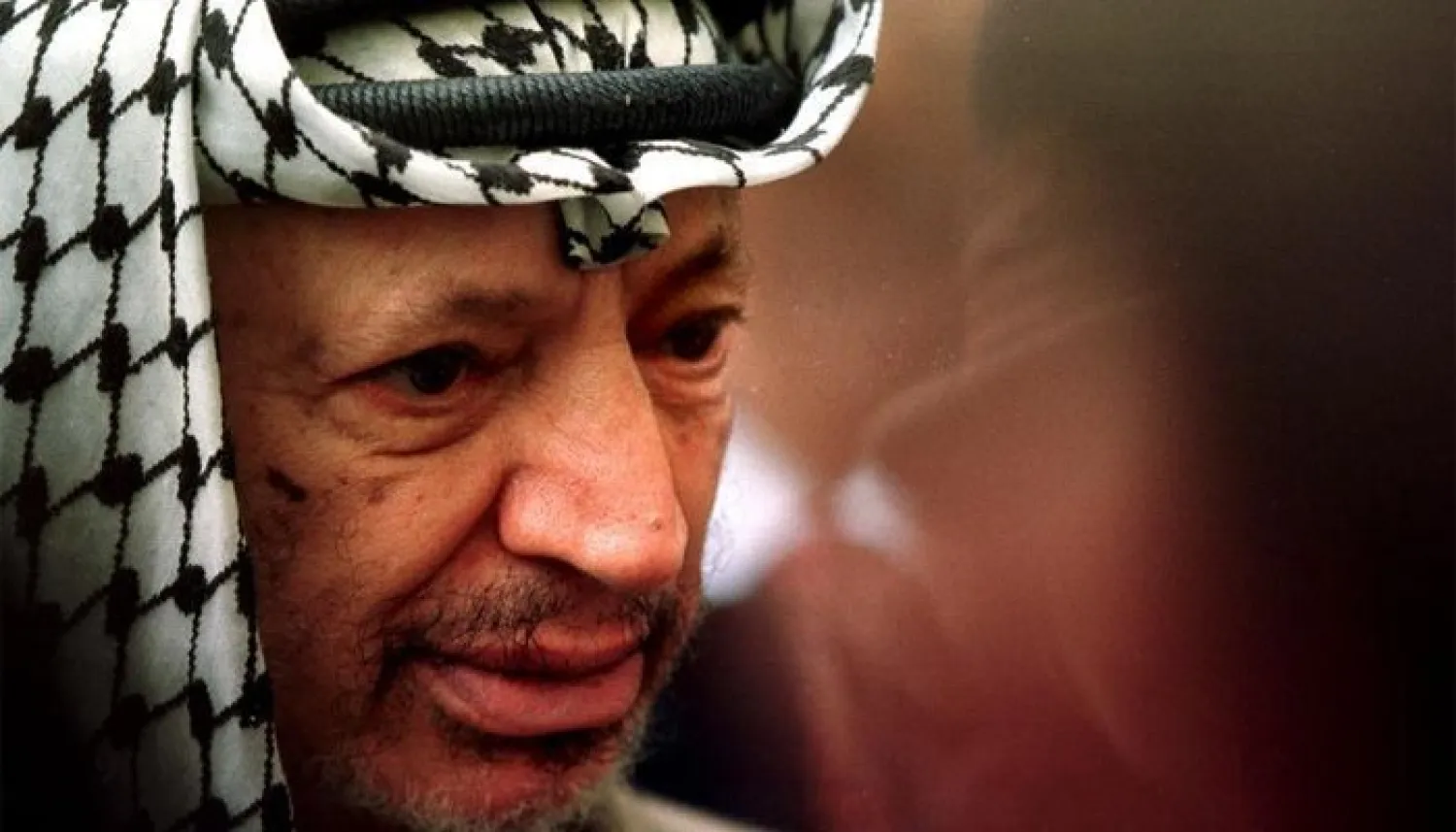 Late Palestinian president Yasser Arafat listens to journalists at the National Assembly. REUTERS file photo