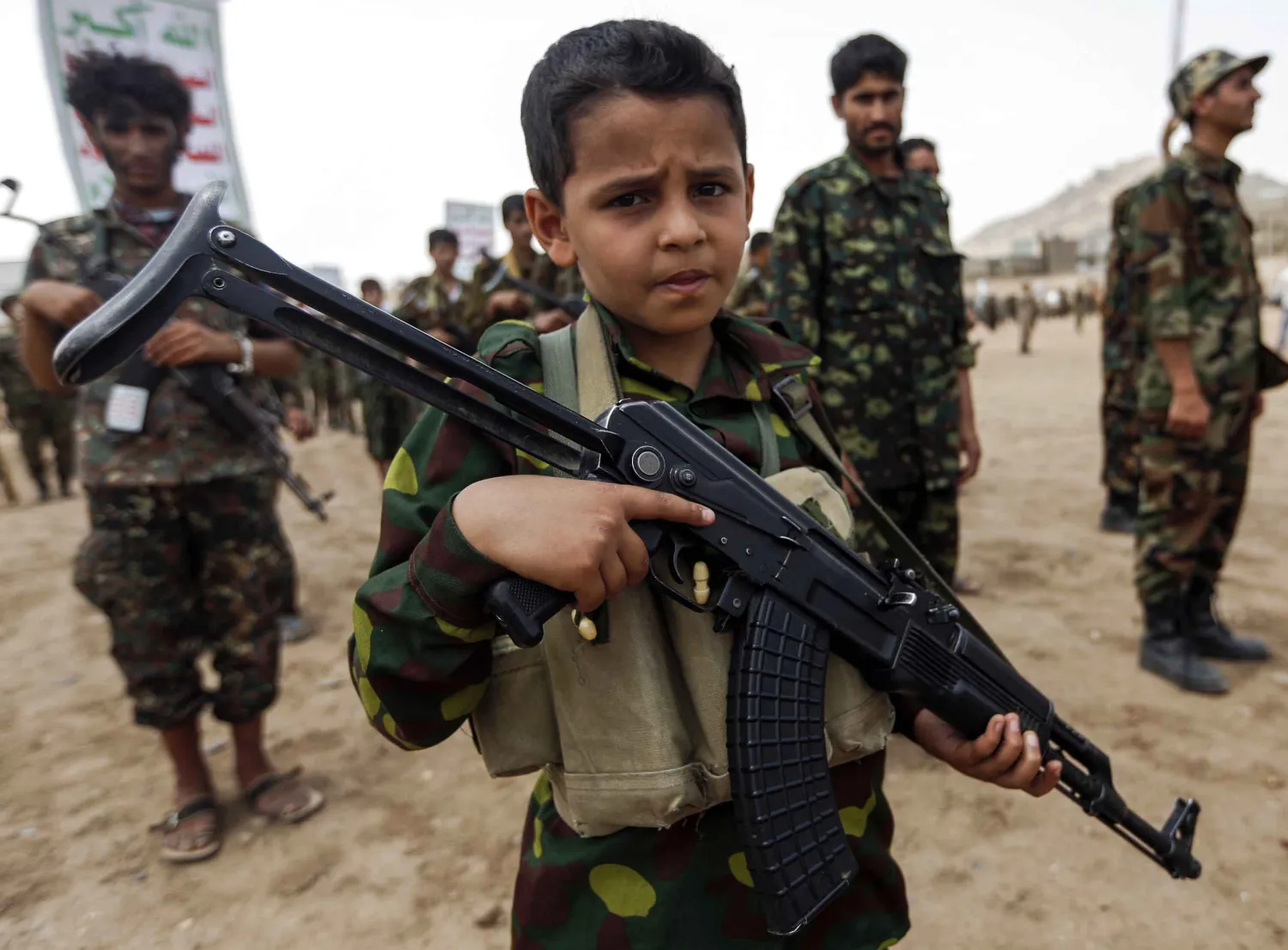 A Yemeni boy poses with a Kalashnikov at a Houthi rally in Sana'a in July 2017. AFP file photo