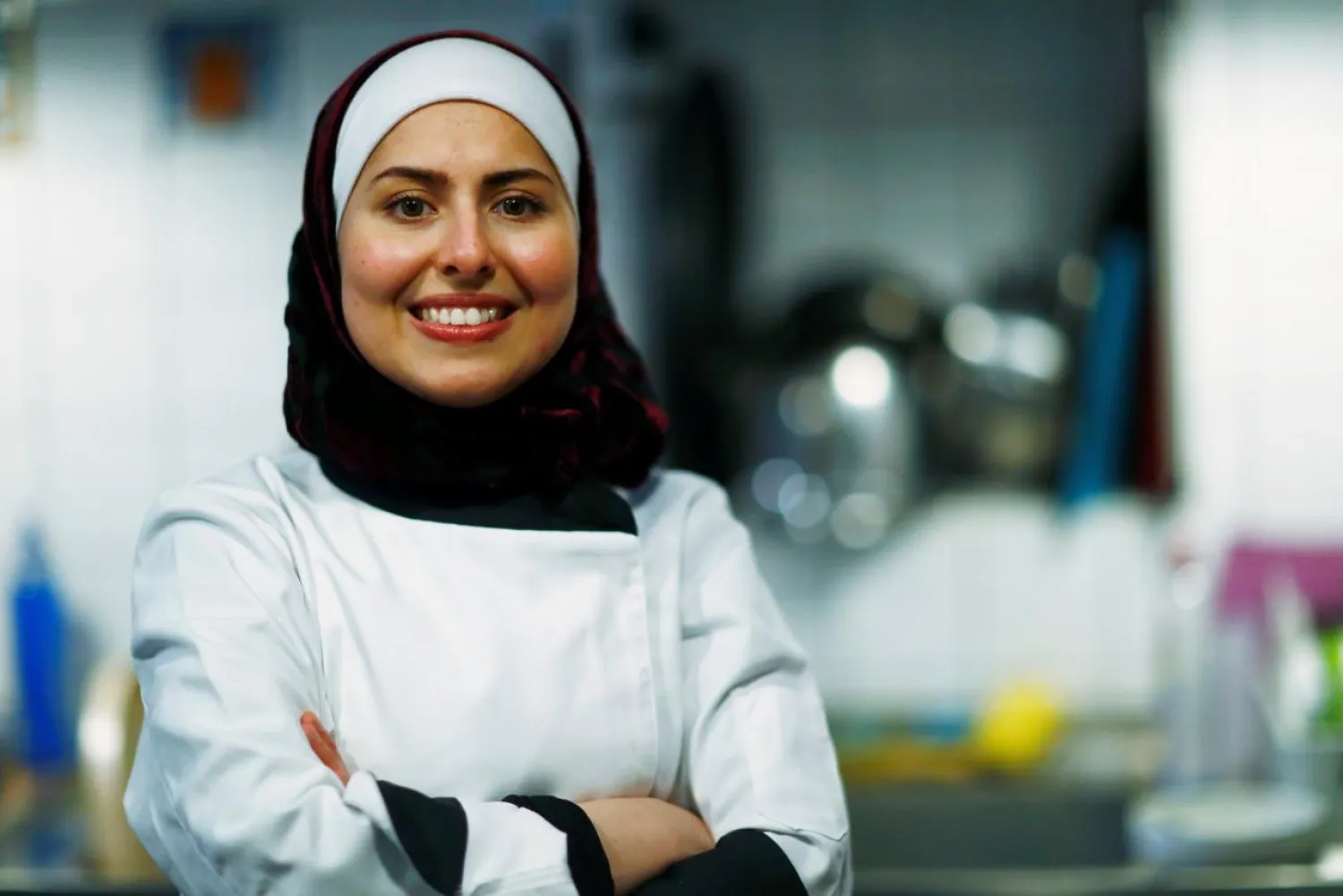 Syrian migrant Malakeh Jazmati poses for a picture in a kitchen of Cafe in Berlin, Germany January 23, 2018. REUTERS/Hannibal Hanschke