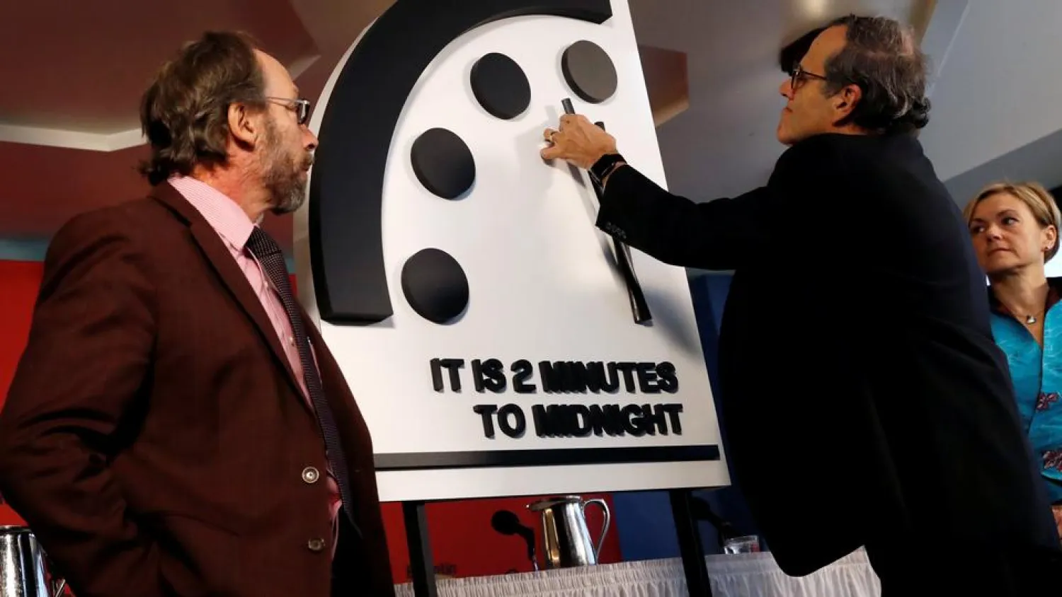 Members of the Bulletin of the Atomic Scientists move the 'Doomsday Clock' hands to two minutes until midnight at a news conference in Washington, US January 25, 2018. (Reuters)