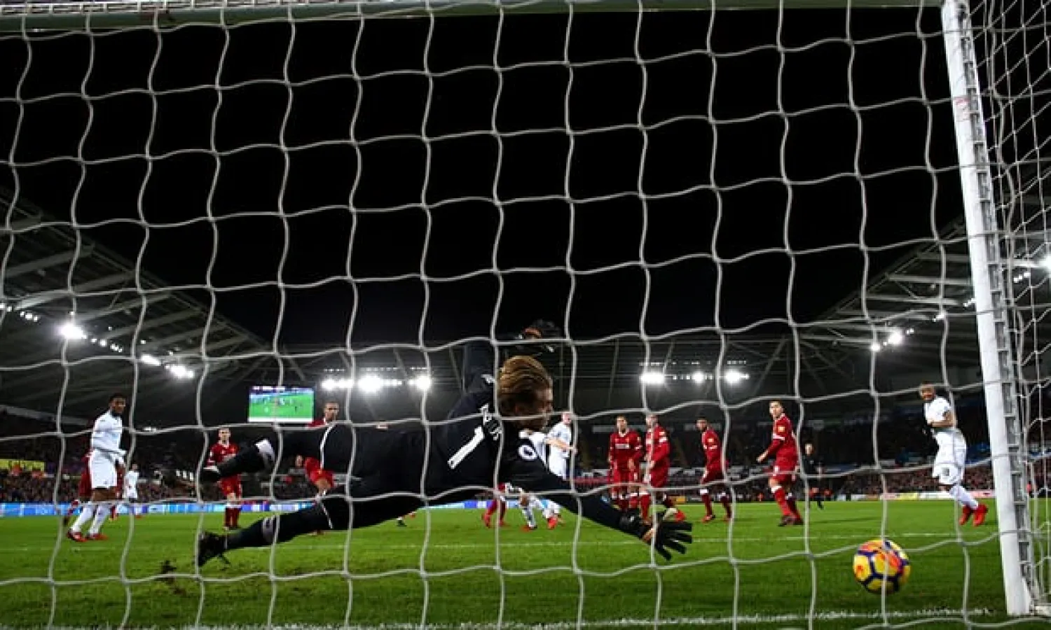  Alfie Mawson leaves Loris Karius helpless at the Liberty Stadium – but the sound of nets rustling has been rare for relegation battlers. Photograph: Michael Steele/Getty Images
