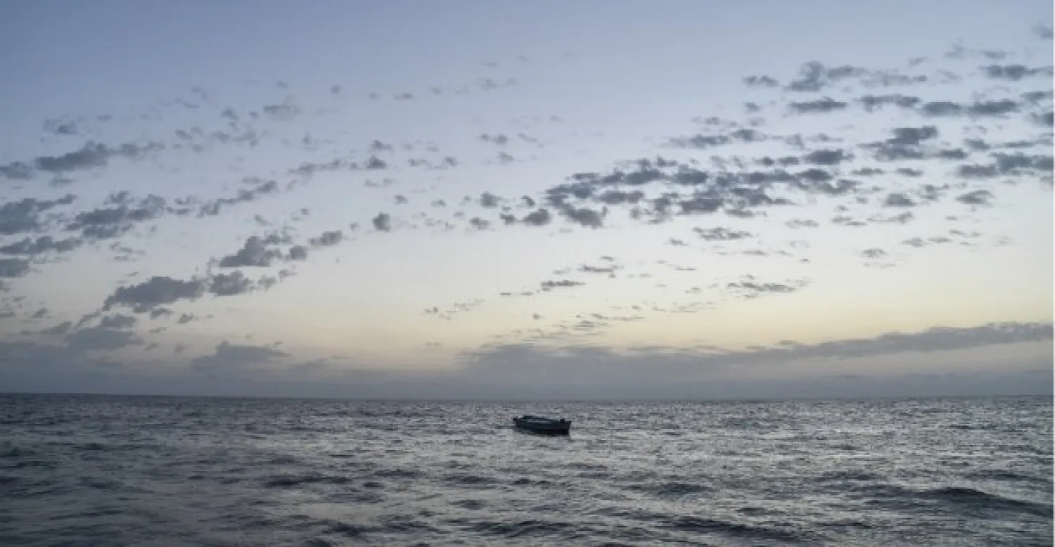 A small wooden boat used by migrants to cross the Mediterranean sea is abandoned after a rescue operation by the Topaz Responder ship run by Maltese NGO Moas and the Italian Red Cross on November 3, 2016, off the Libyan coast. PHOTO: Andreas Solaro, AFP
