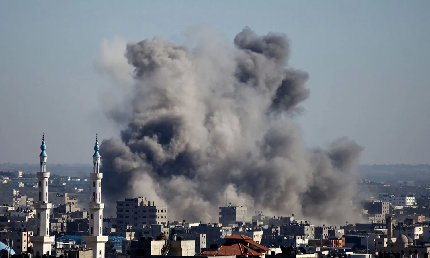 Smoke billows from buildings following an Israeli air strike in Gaza City in 2014. (AFP)