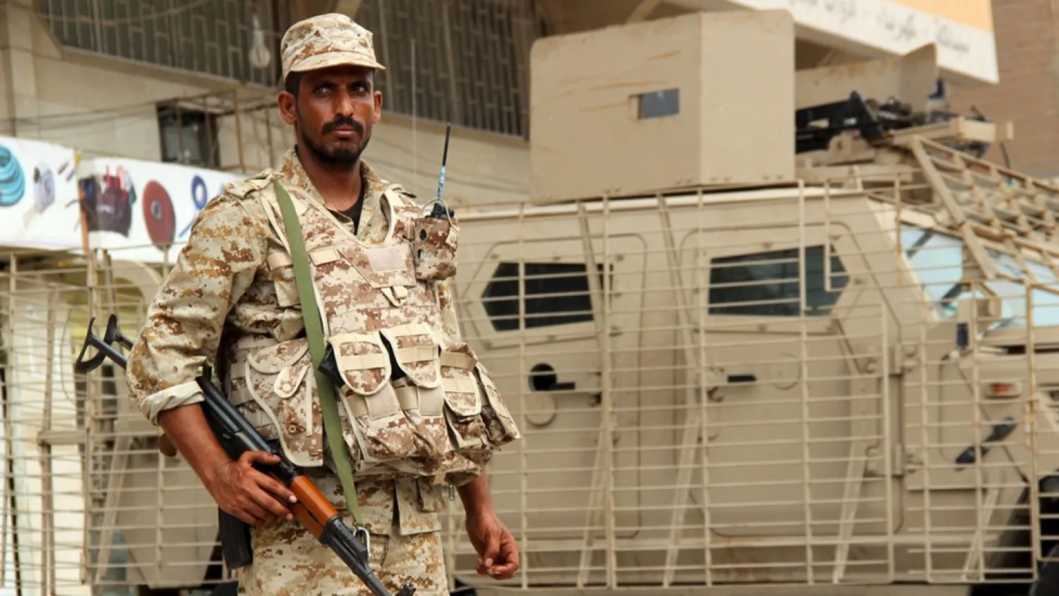 A Yemeni army soldier stands guard as he secures a street in Mansoura, Yemen. (Reuters)