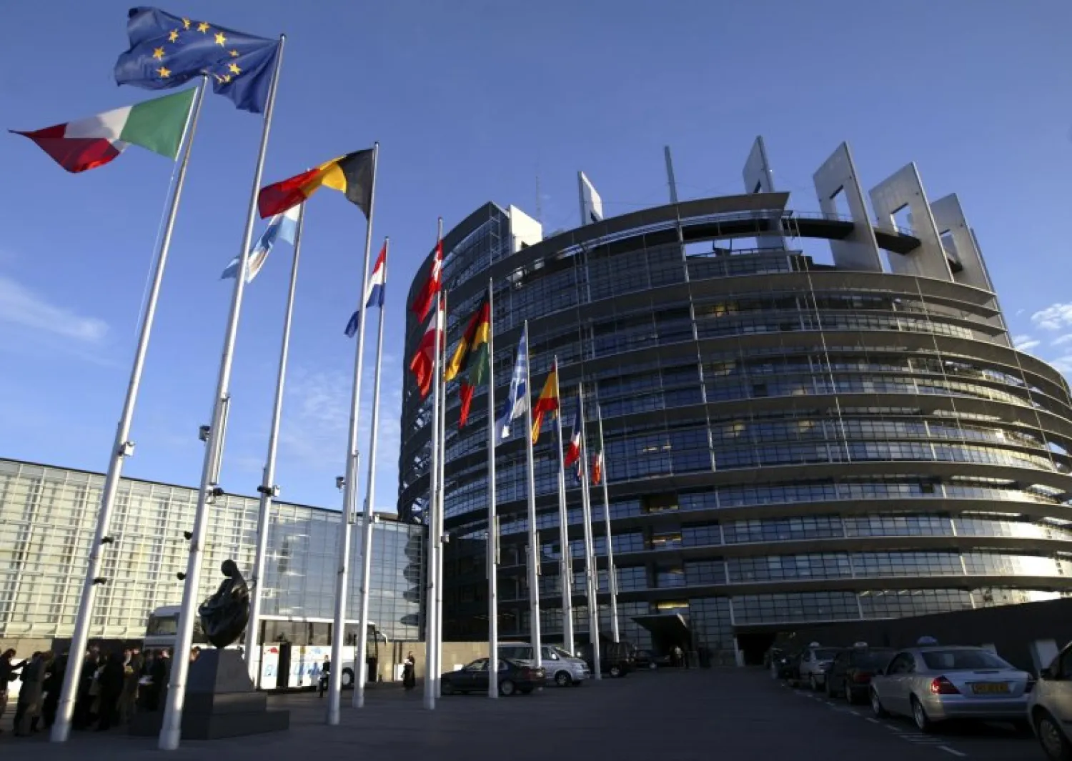 File picture shows European Union member states' flags flying in front of the building of the European Parliament in Strasbourg, April 21, 2004.
