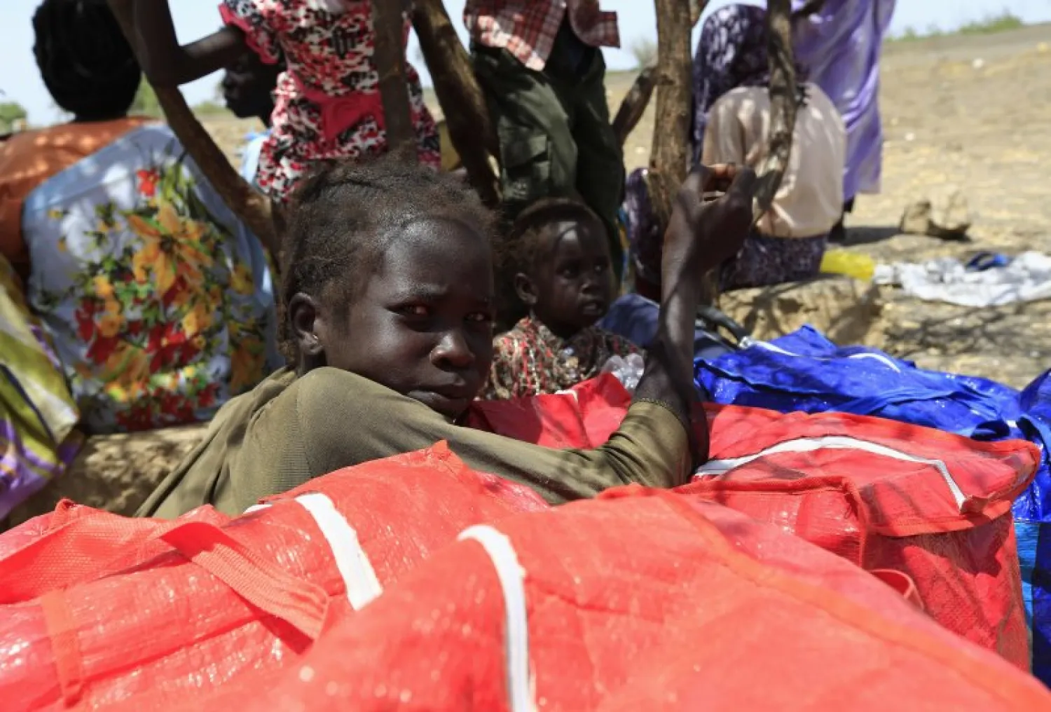 South Sudanese fleeing an attack on the town of Rank rest upon arrival at a border gate in Joda, along the Sudanese border. Reuters file photo