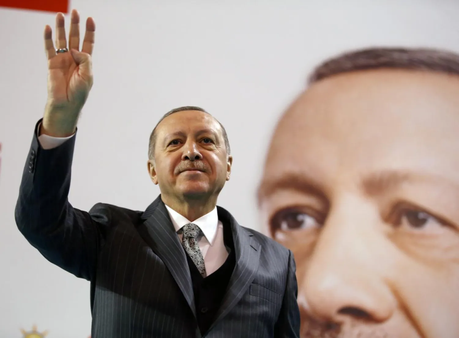 Turkish President Recep Tayyip Erdogan greets his supporters during a meeting of the ruling AK Party in Corum, Turkey January 28, 2018. Reuters
