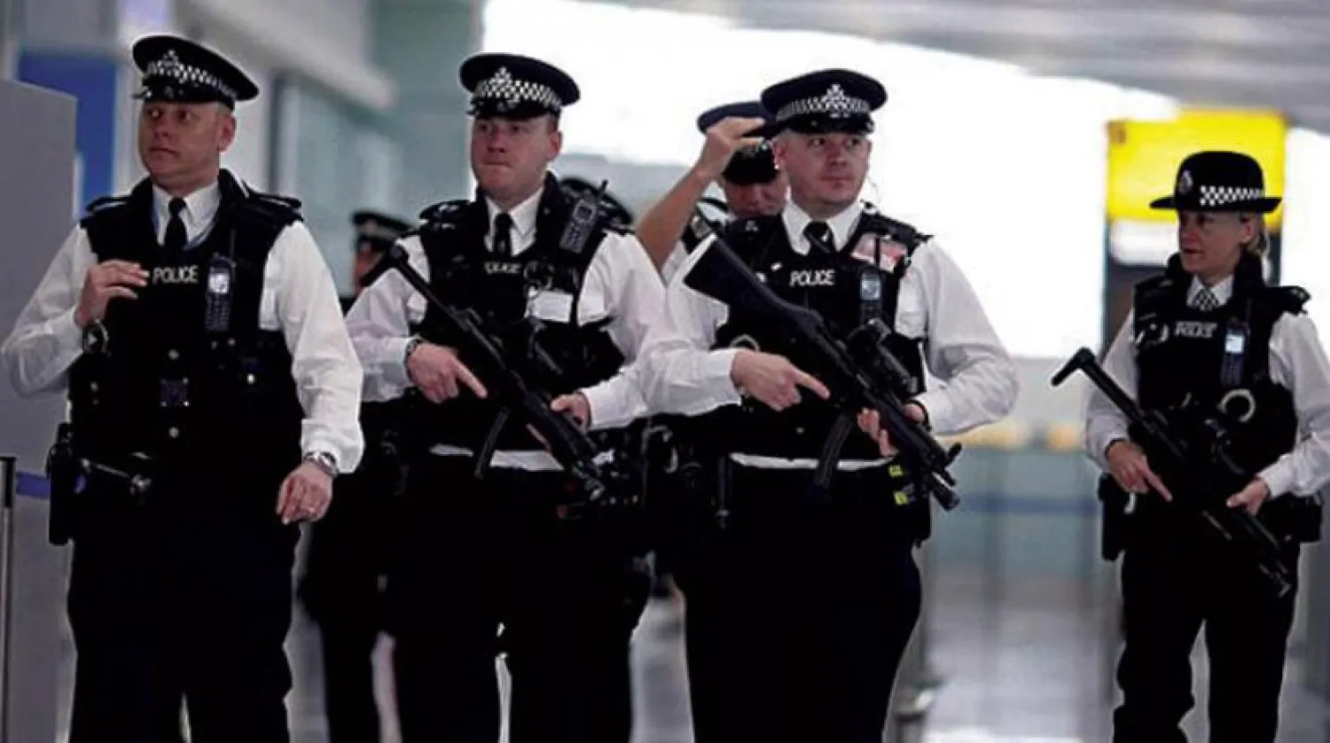 Police officers at Heathrow Airport (AFP)