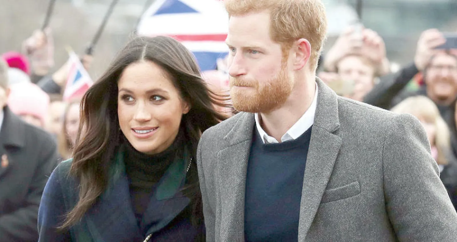 الأمير هاري وميغان ماركل في زيارتهما الرسمية الأولى إلى اسكتلندا أمس (رويترز)