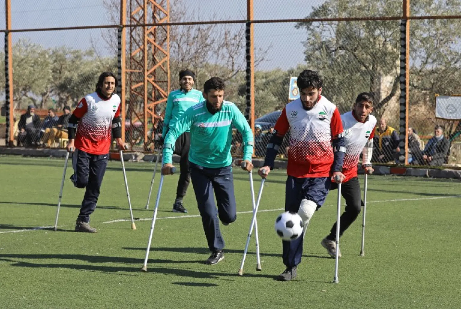 Syrian amputees who were handicapped in the war take part in a football match organised by a center for physical therapy in Idlib. OMAR HAJ KADOUR / AFP