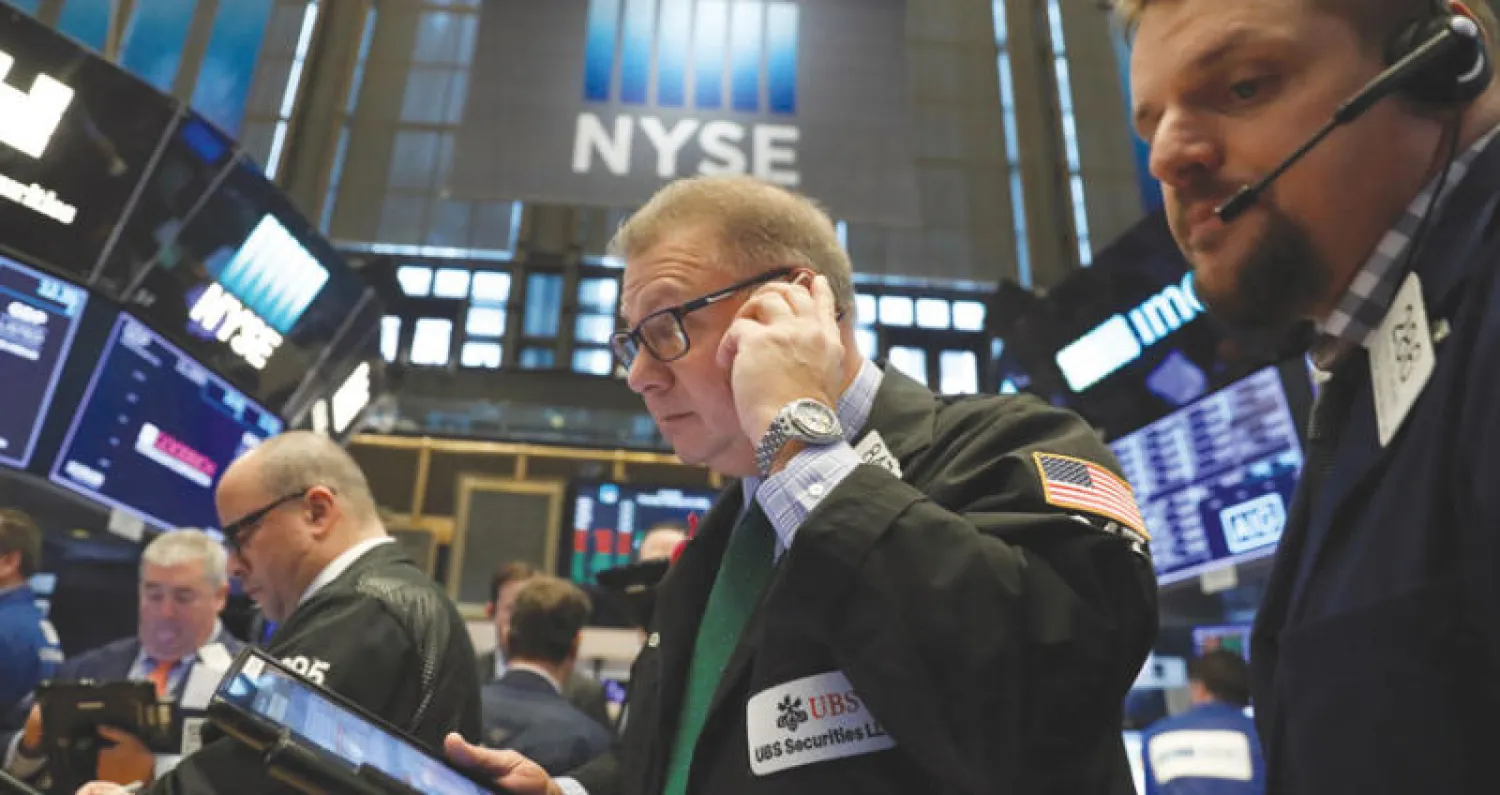 متعاملون في بورصة نيويورك أمس (رويترز)