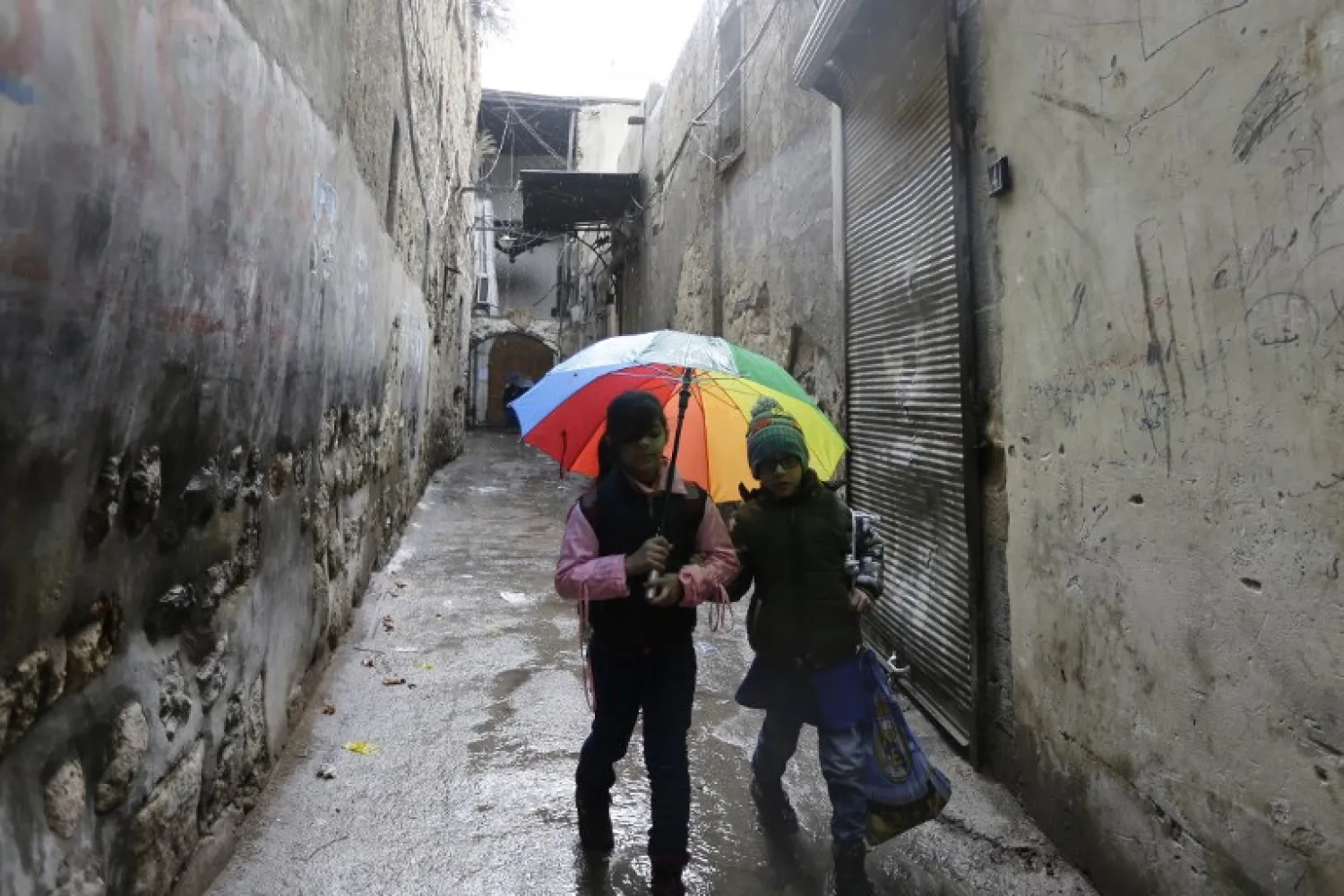 Syrian students head to school on February 18, 2018, following days of calm in Damascus' Old City that has been bombarded by rebels entrenched on the capital's outskirts. LOUAI BESHARA / AFP