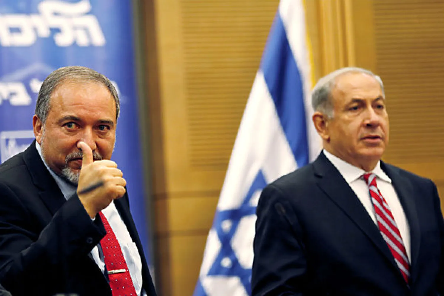 Israel's Prime Minister Benjamin Netanyahu (R) sits next to Defense Minister Avigdor Lieberman (File Photo: Reuters)