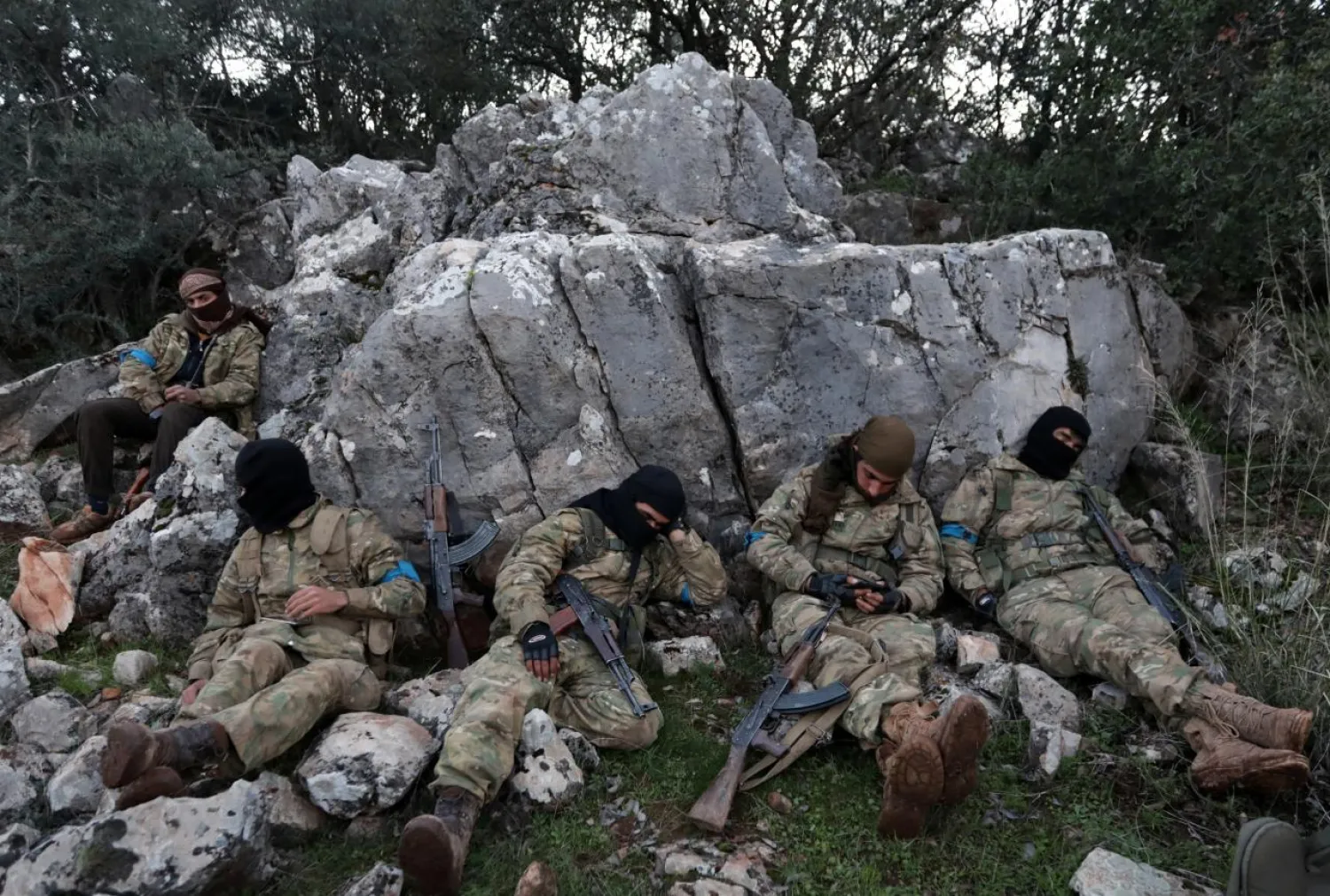 Turkish-backed Free Syrian Army fighters rest near the city of Afrin, Syria. REUTERS/Khalil Ashawi