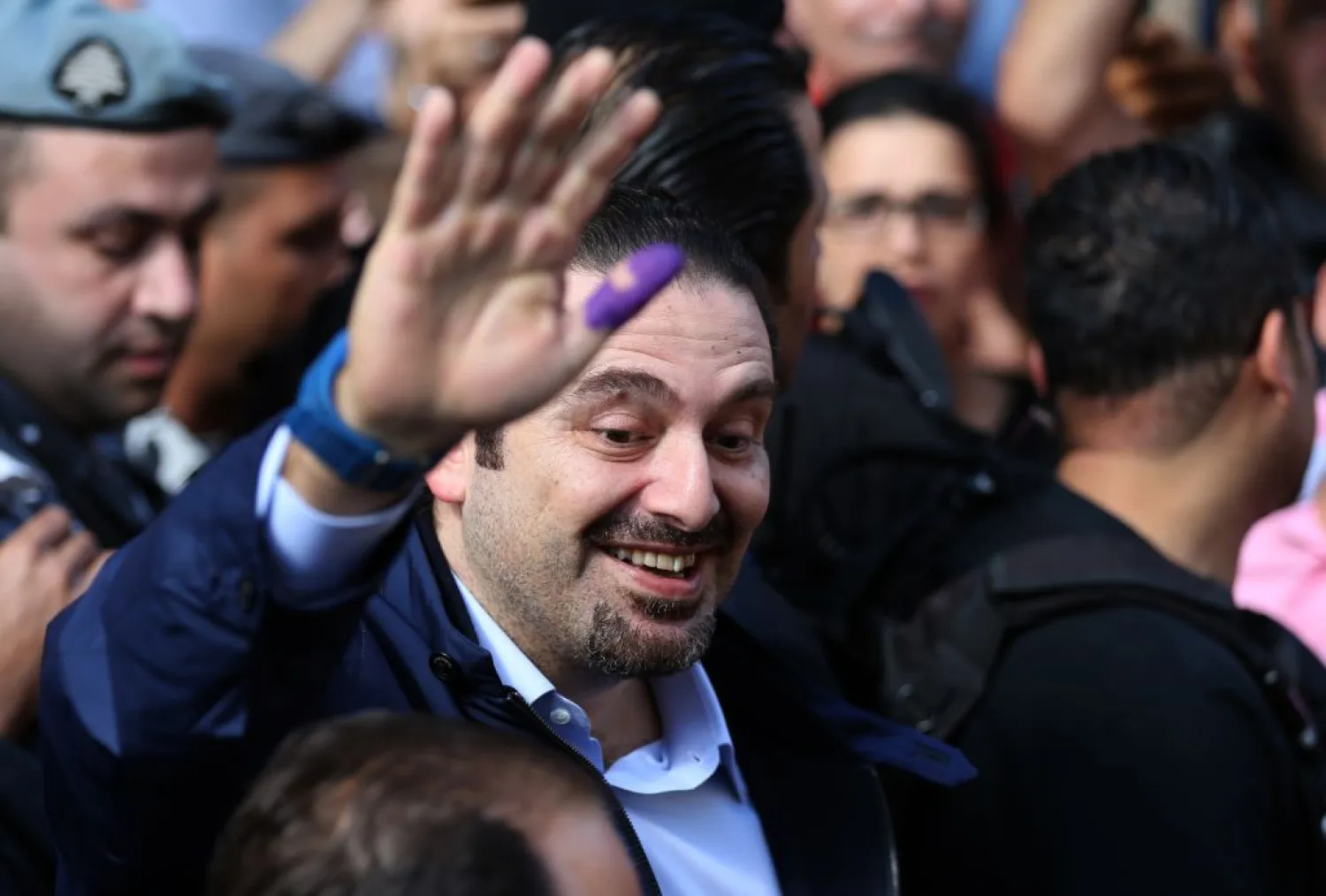  Lebanese Prime Minister Saad Hariri waves to his supporters after casting his ballot during municipal elections, outside a voting station in Beirut, Lebanon, May 8, 2016. (AP/Hussein Malla)
