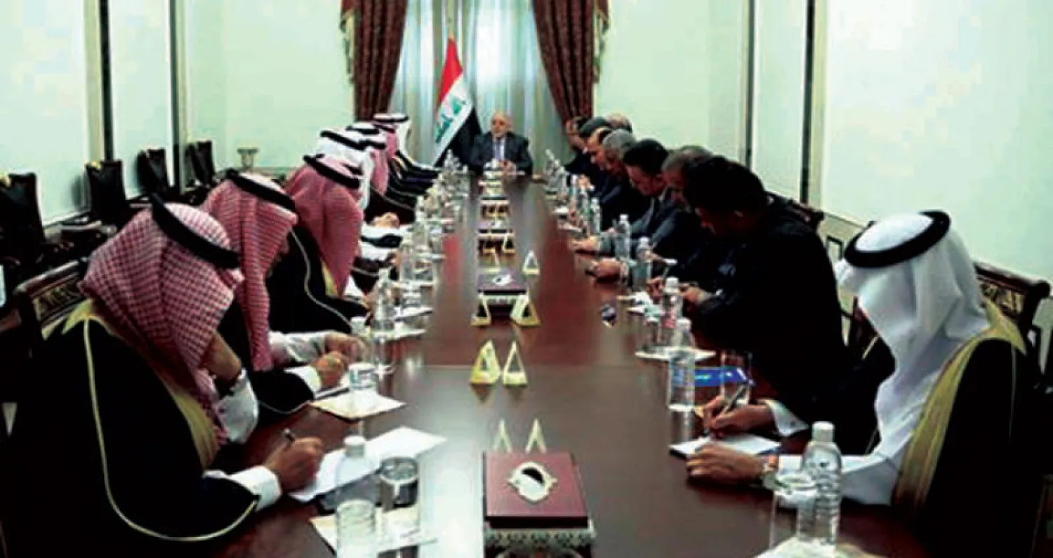 العبادي مستقبلاً الوفد الإعلامي السعودي أمس (رئاسة الوزراء العراقية)