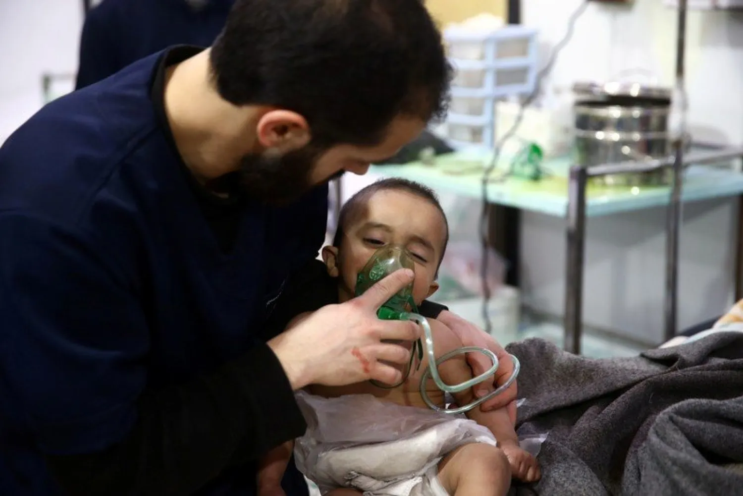 Man with a child are seen in hospital in the besieged town of Douma, Eastern Ghouta, Damascus. Thomson Reuters