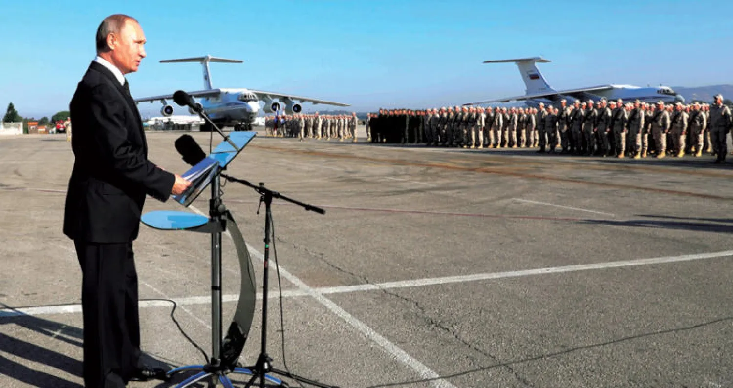 الرئيس الروسي بوتين لدى زيارته قاعدة حميميم الجوية في سوريا في ديسمبر الماضي (إ.ب.أ)
