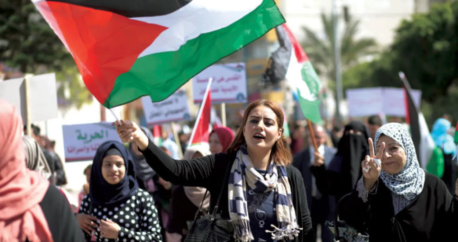 فلسطينيات يطالبن برفع الحصار عن غزة خلال مسيرة في اليوم العالمي للمرأة (أ..ف.ب)