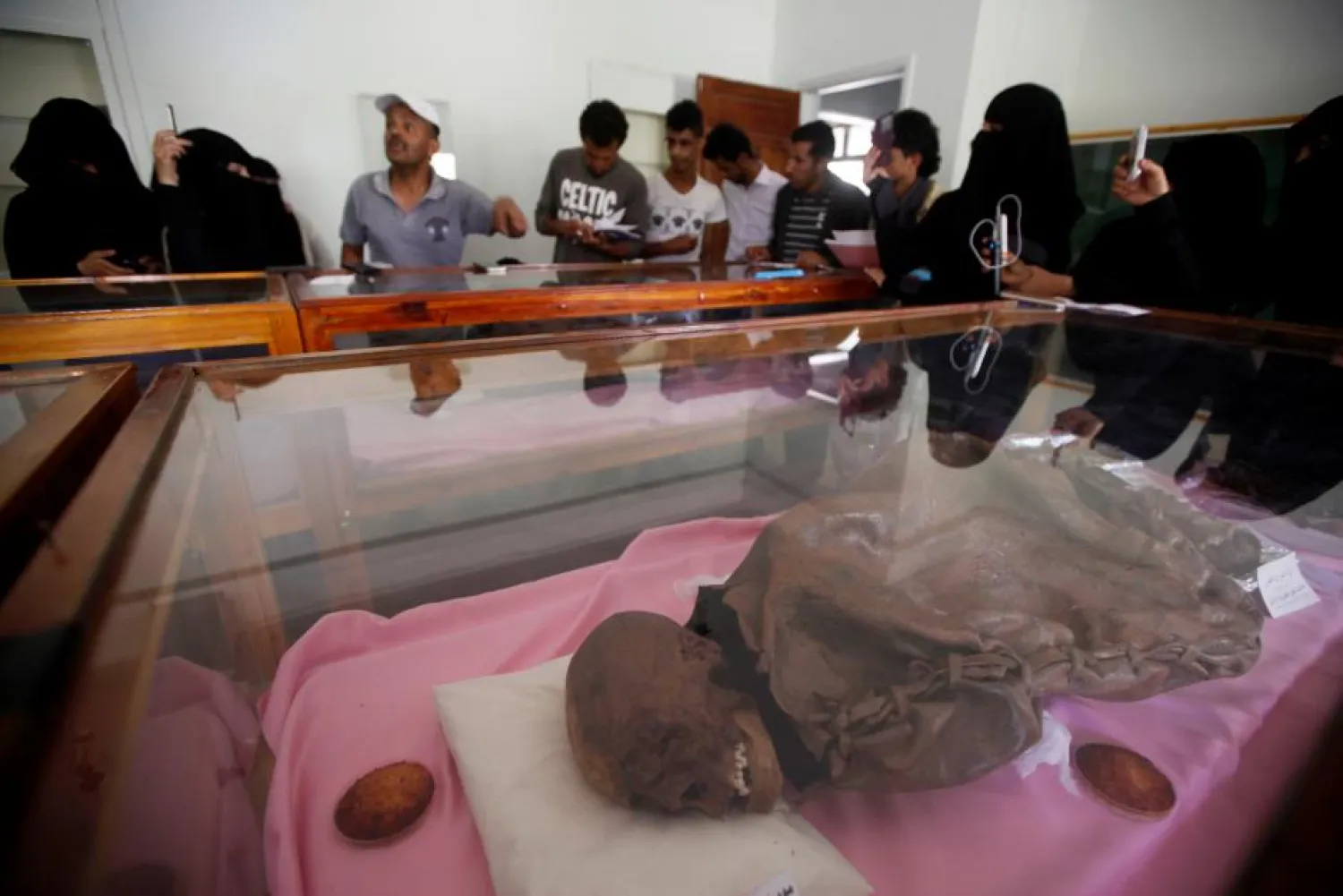 People look at a mummy dating back to an ancient Yemen era displayed at a museum at Sanaa University, in Sanaa, Yemen. (Reuters)