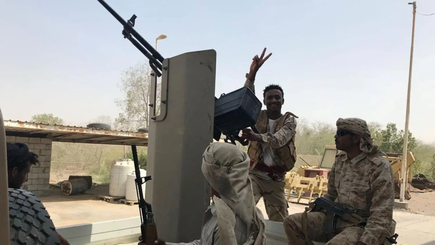 Yemeni soldiers ride on the back of a military patrol vehicle in the Red Sea port city of Al Mokha, Yemen on March 5, 2018. Aziz El Yaakoubi / Reuters
