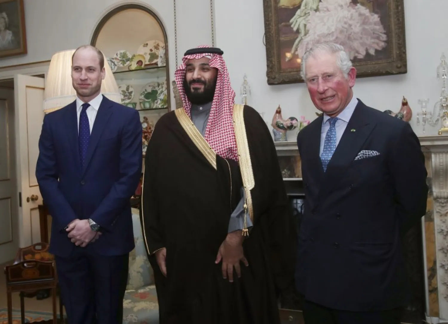 Britain's Prince Charles, Prince of Wales (R) and Britain's Prince William, Duke of Cambridge, (L) meet with Saudi Arabia's Crown Prince Mohammed bin Salman (C) for dinner at Clarence House in central London on March 7, 2018.  Yui Mok / POOL / AFP 