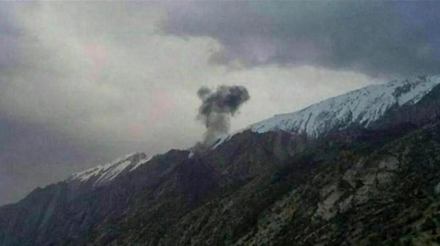 A photo showing smoke billowing from the remote mountains in the Zagros range, where the plane has crashed. Getty images