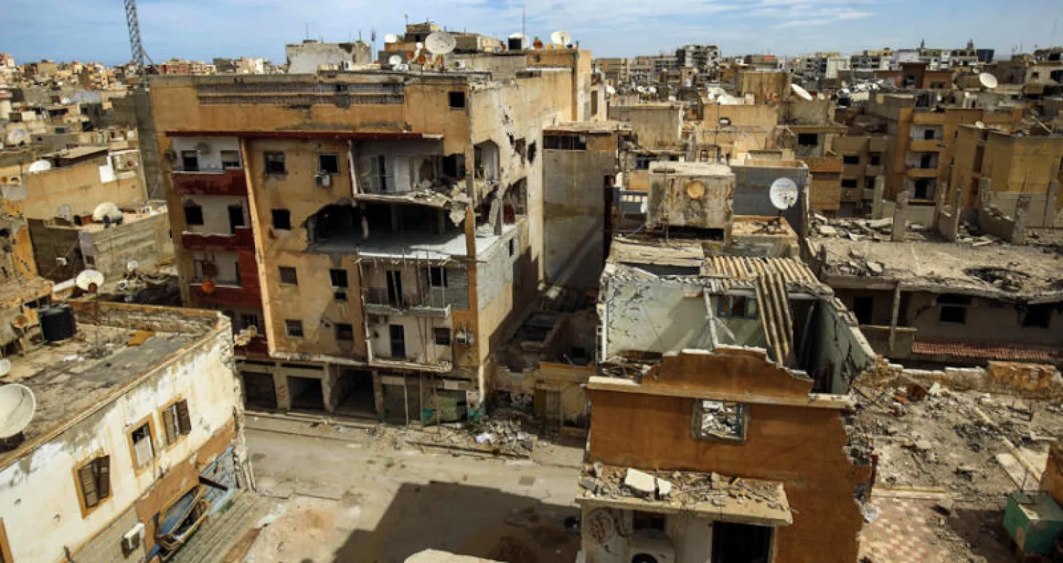 منازل مدمرة في مدينة بنغازي أمس بعد سبع سنوات من الاقتتال (أ.ف.ب)