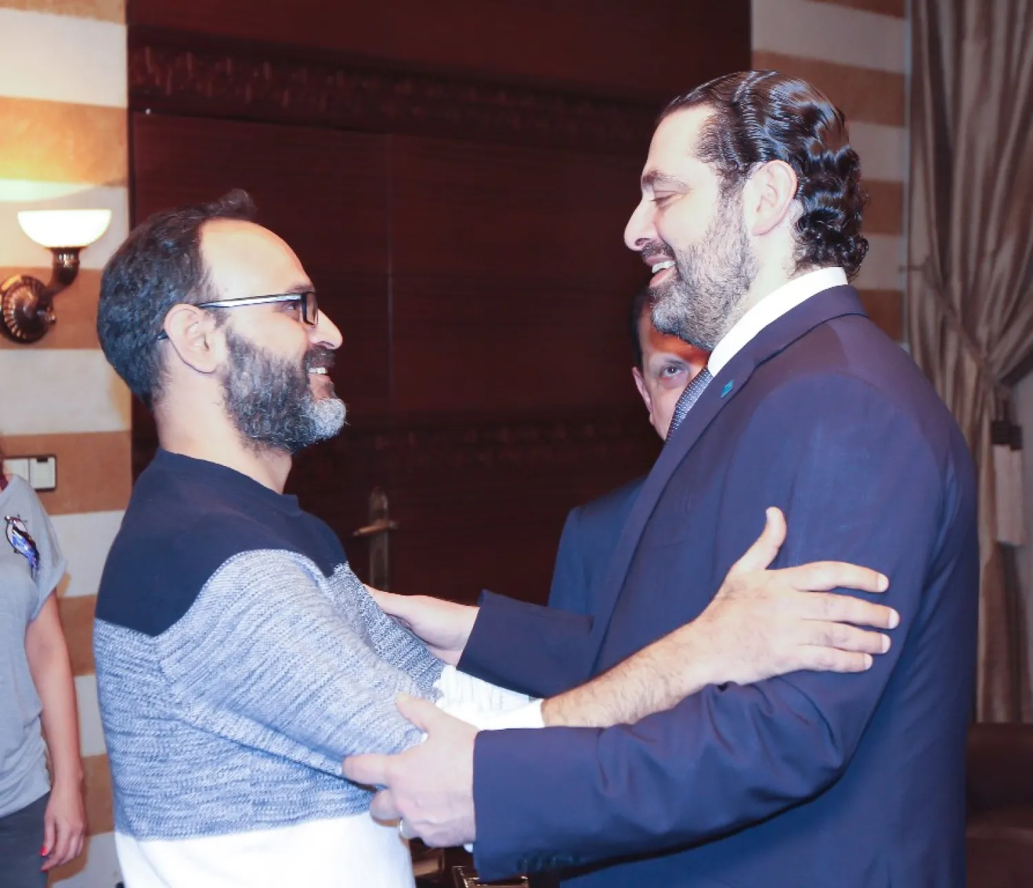 Lebanese Prime Minister Saad Hariri receives actor and writer Ziad Itani after his release from custody. (NNA)