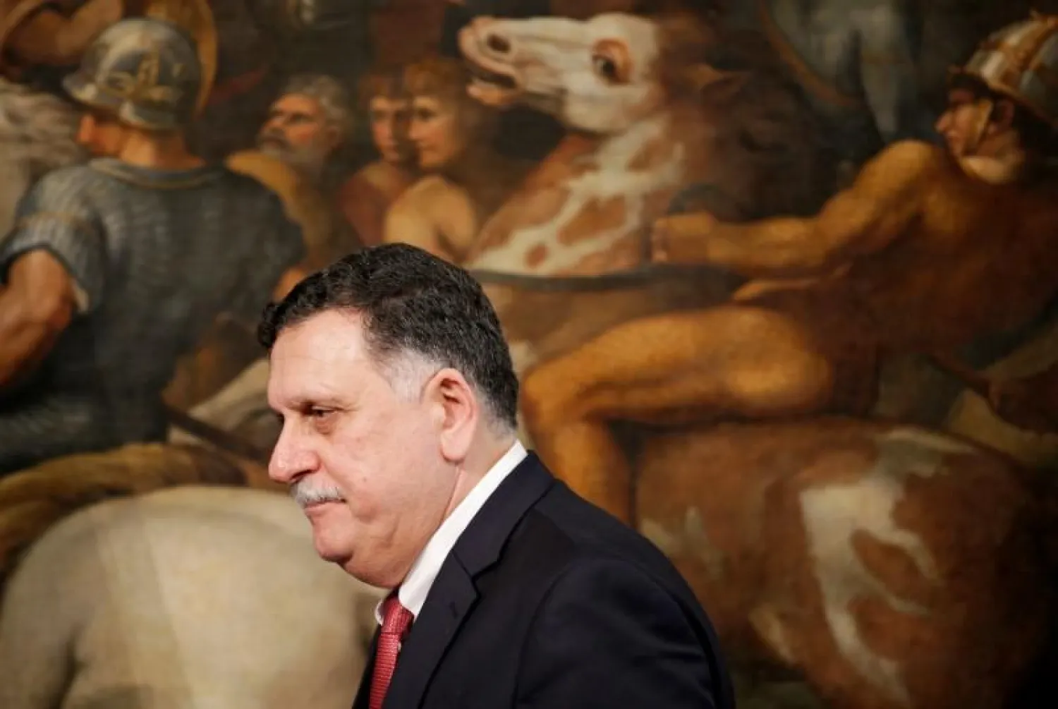Libyan Prime Minister Fayez al-Sarraj arrives to attend a news conference with his Italian counterpart Paolo Gentiloni. Photo: Reuters 