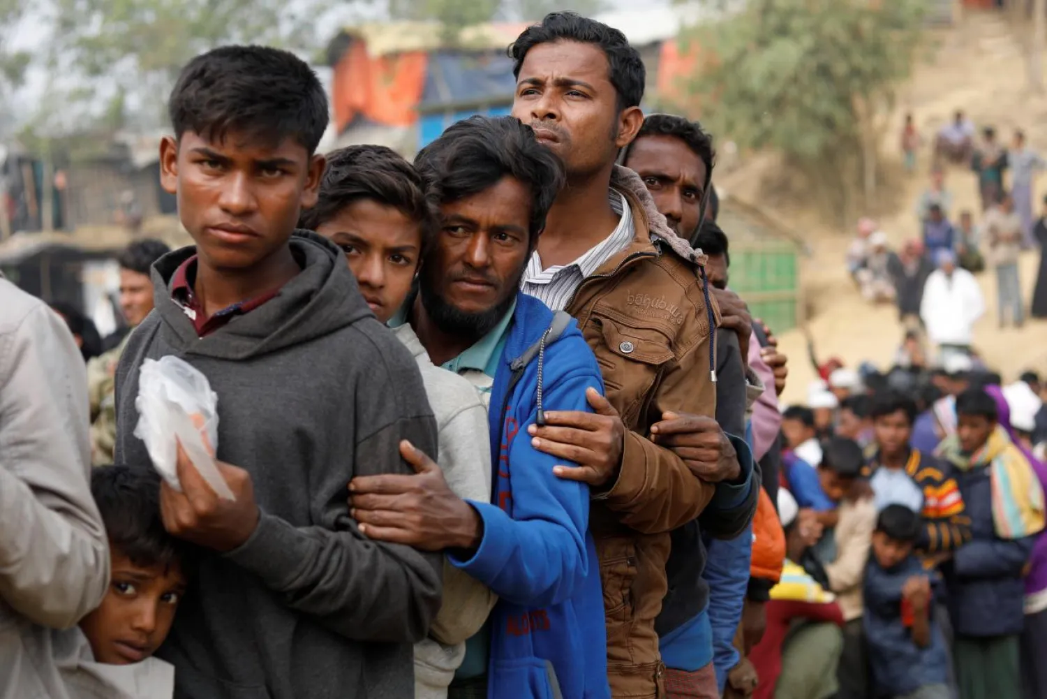 Rohingya refugees line up for daily essentials distribution at Balukhali camp, near Cox's Bazar, Bangladesh. (Reuters)
