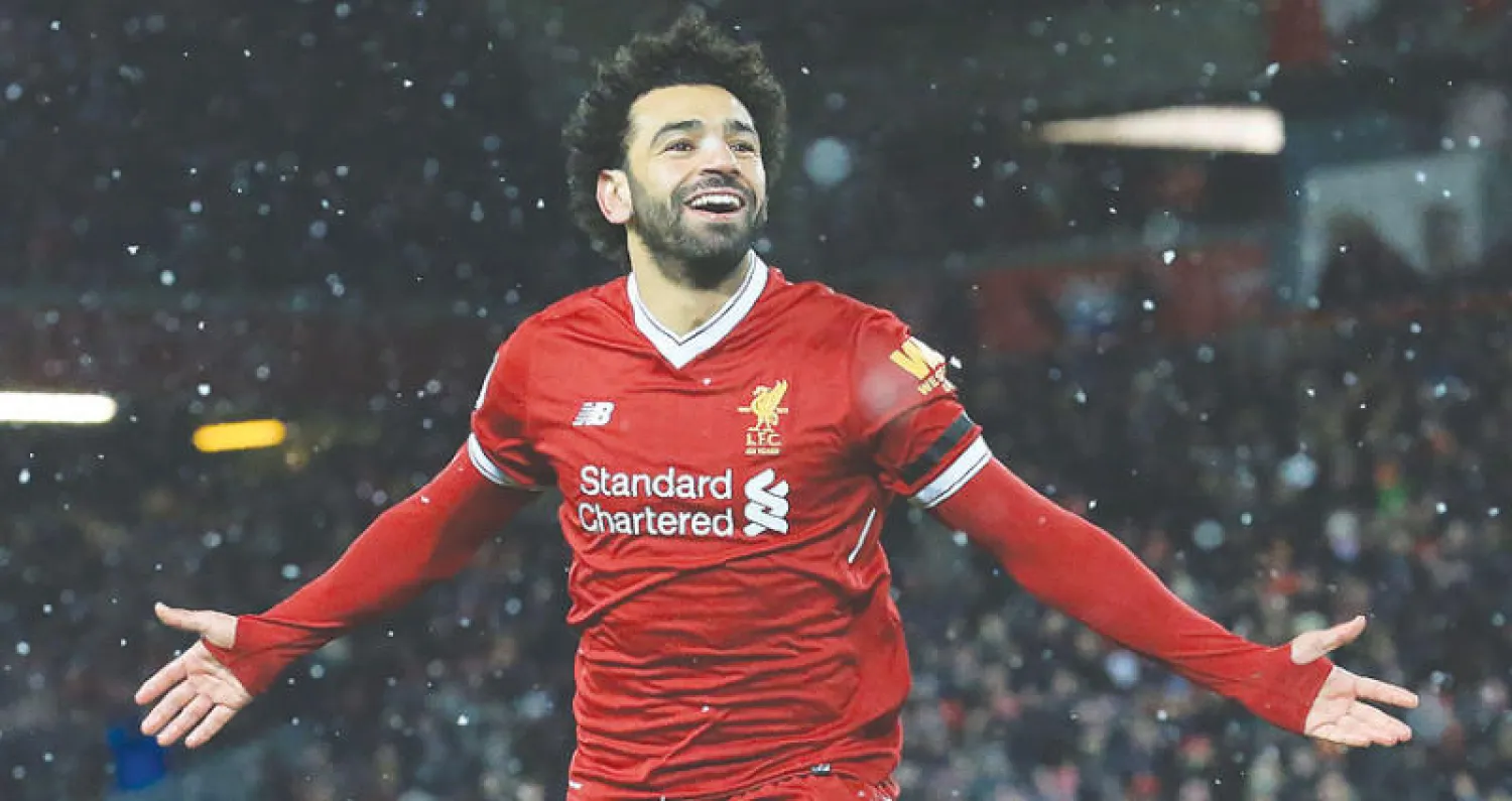 صلاح يحتفل برباعيته التاريخية في مرمى واتفورد (أ.ف.ب)