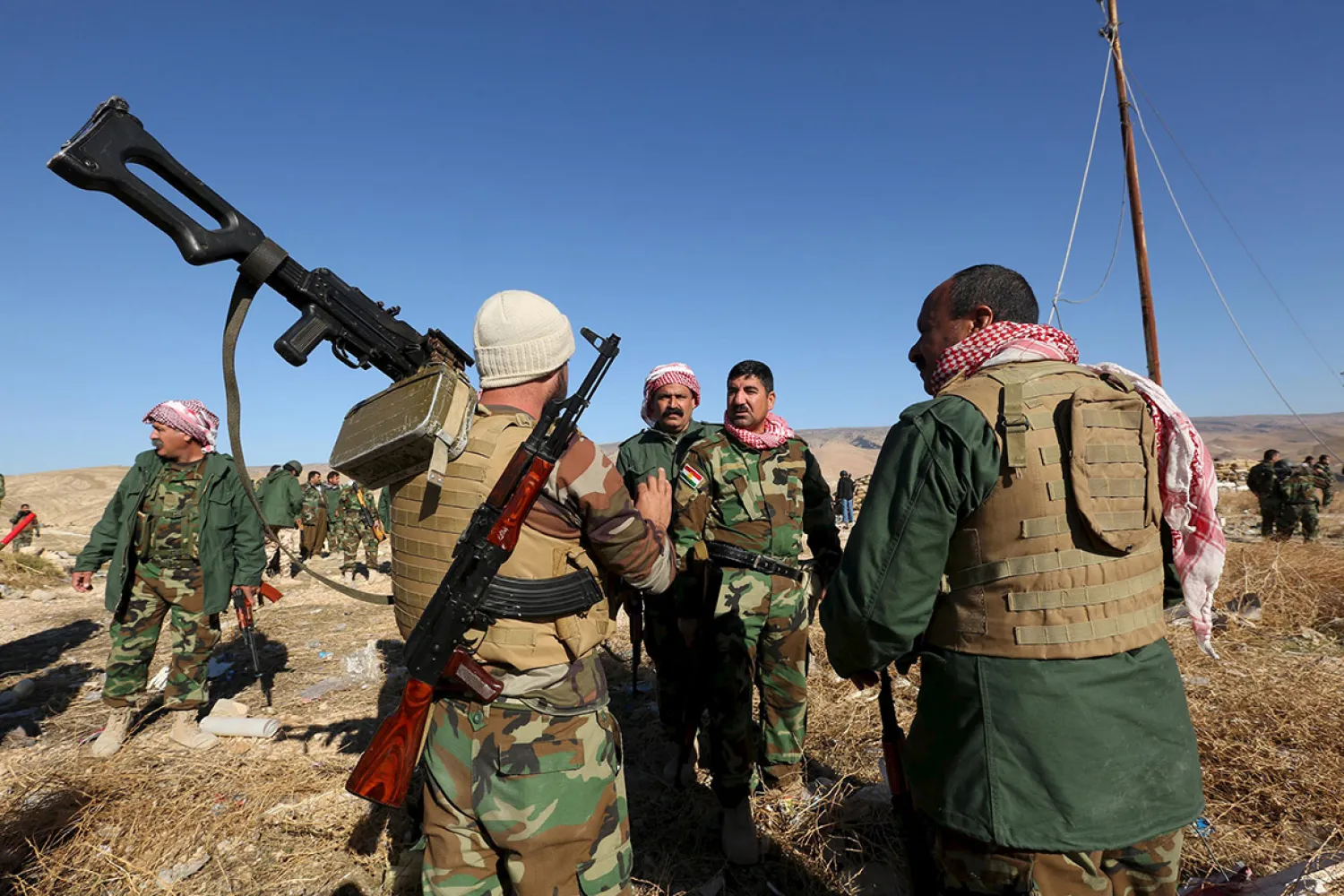 Peshmerga forces discuss tactics after securing several strategic facilities in the northern Iraqi town of Sinjar Ari Jalal/Reuters
